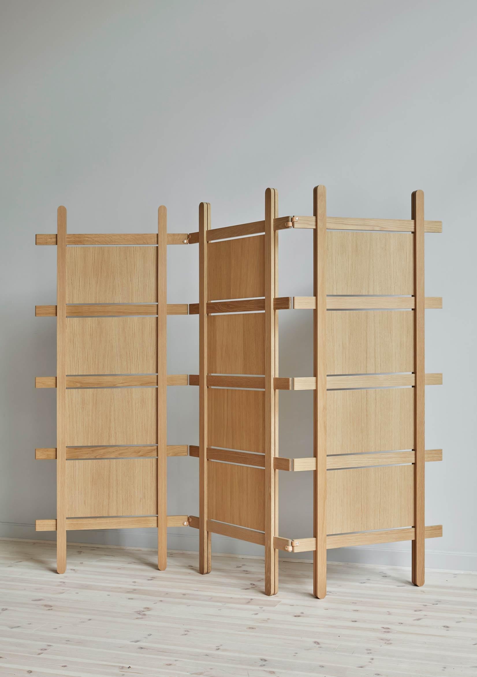 Natural Fold room divider by Storängen Design
Dimensions: D 4 x W 70 x H 170 cm
Materials: oak wood, leather straps.
Available in other colors and with or without pannels.

Fold are made from solid oak with an option off veneered panels. The