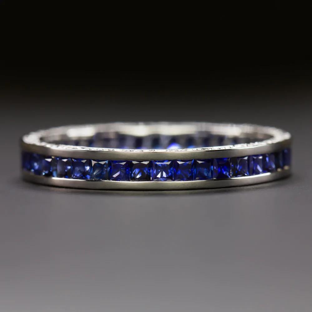 Elegant vintage inspired eternity band, beautifully designed to capture the chic style of the Art Deco era!
The setting features rich French-cut blue natural sapphires meticulously bezel set.
The 14K white gold setting contrasts beautifully with the