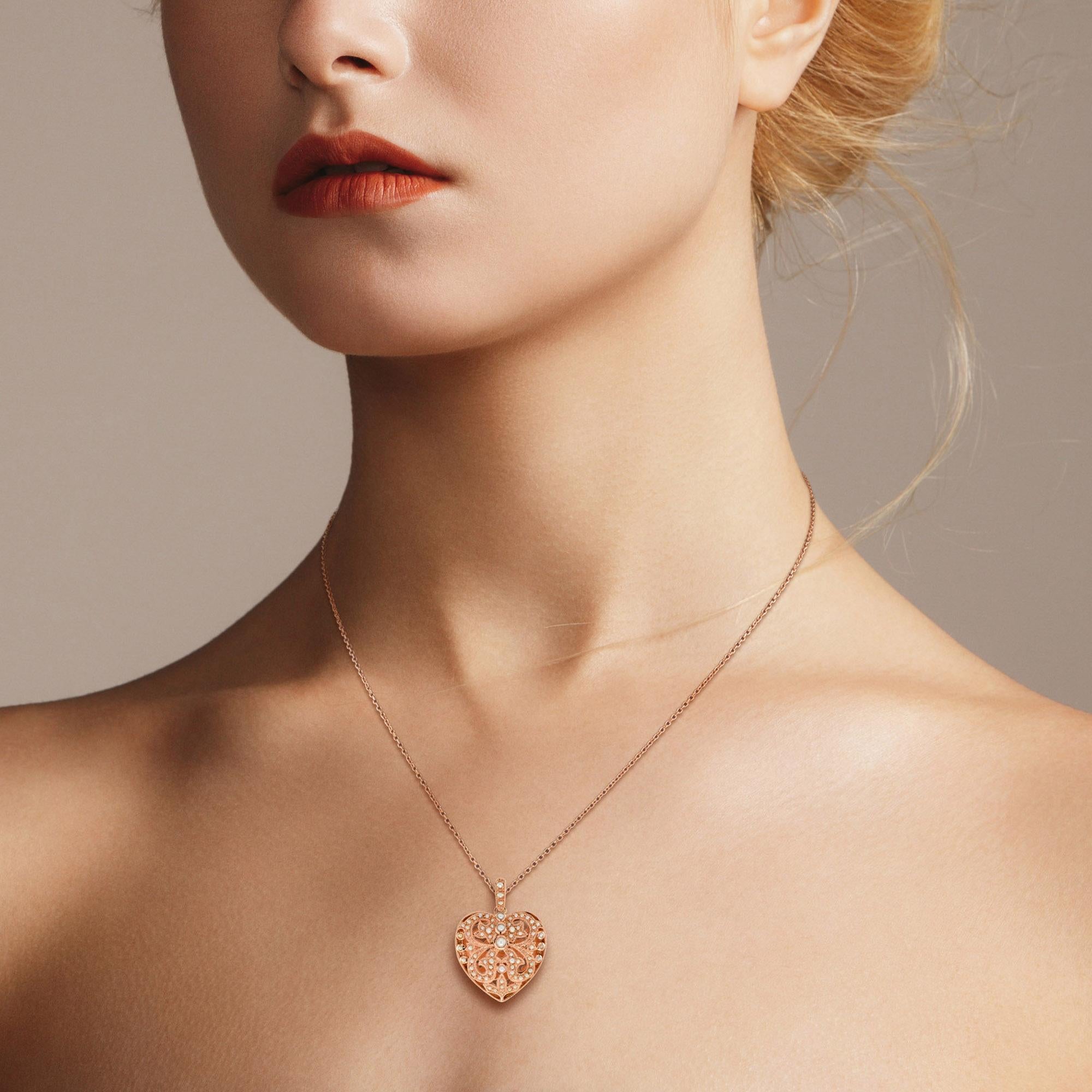 This vintage style pearl heart pendant is so sweet. The filigree heart represents the intricacies of emotions and the elegance of sentiment. The pendant is dotted all oval with 69 seed pearls on rose gold filigree setting. Wear this filigree heart