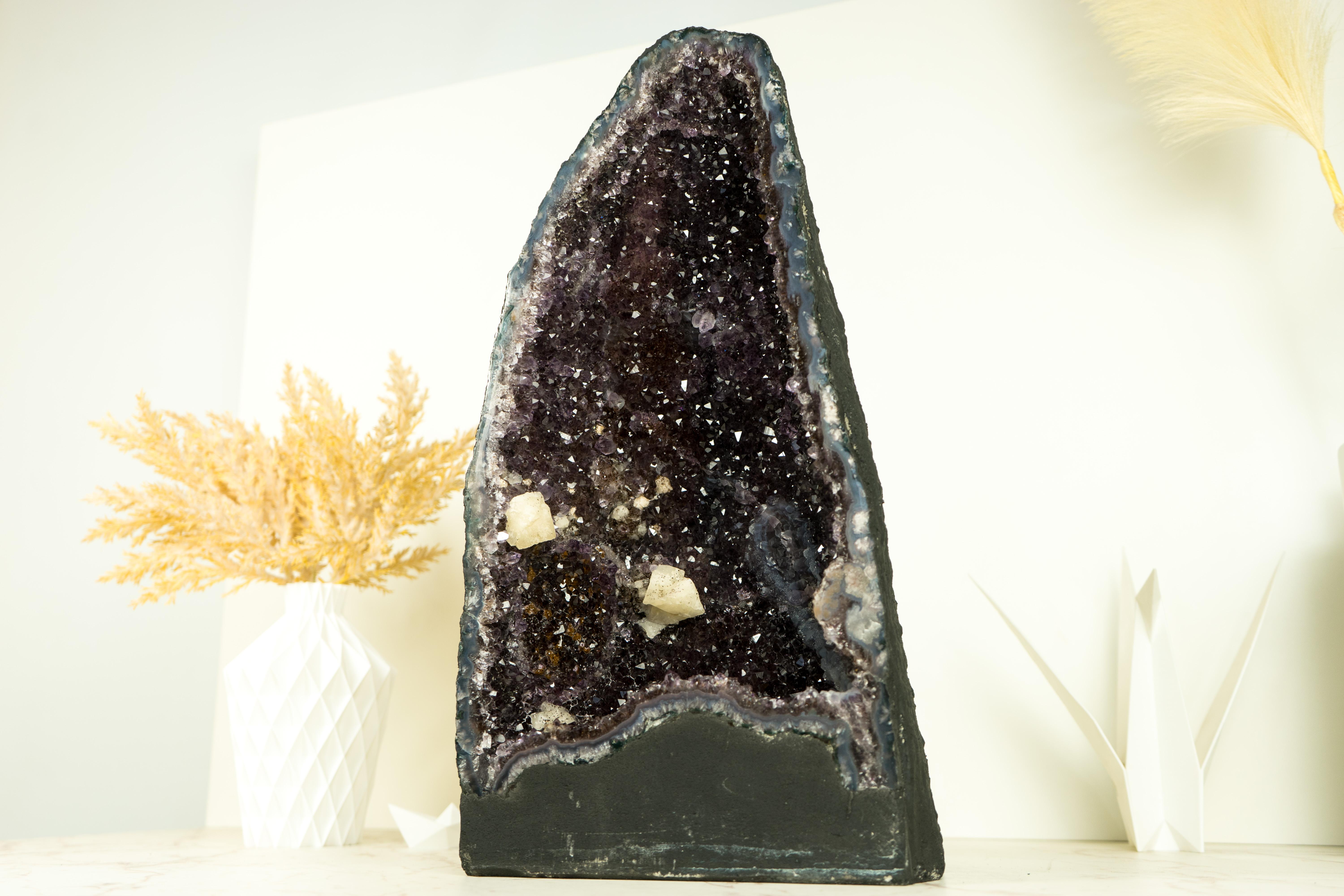 Elevate your space, decor, or collection with the captivating beauty of this Amethyst Geode featuring mesmerizing Galaxy Druzy. This geode brings dark purple Amethyst and calcite, making it a truly one-of-a-kind natural masterpiece.

The first