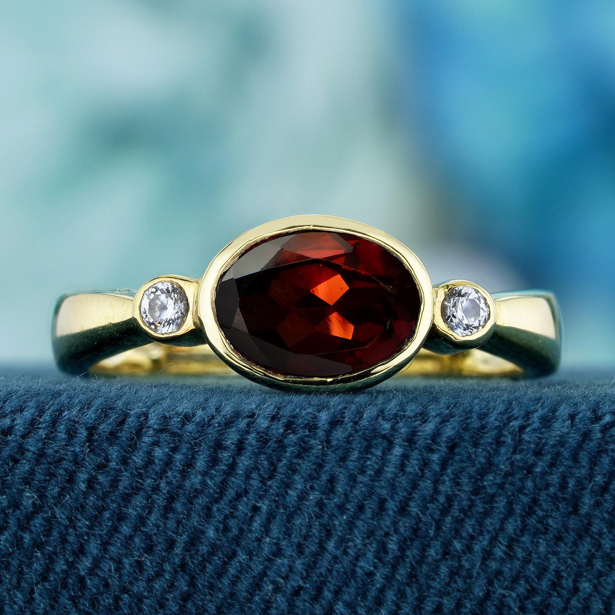 Unveil the timeless elegance within this exquisite antique ring, where natural beauty meets vintage allure in perfect harmony. Crafted in lustrous yellow gold, this captivating piece features a resplendent oval-cut natural garnet, radiating a deep,