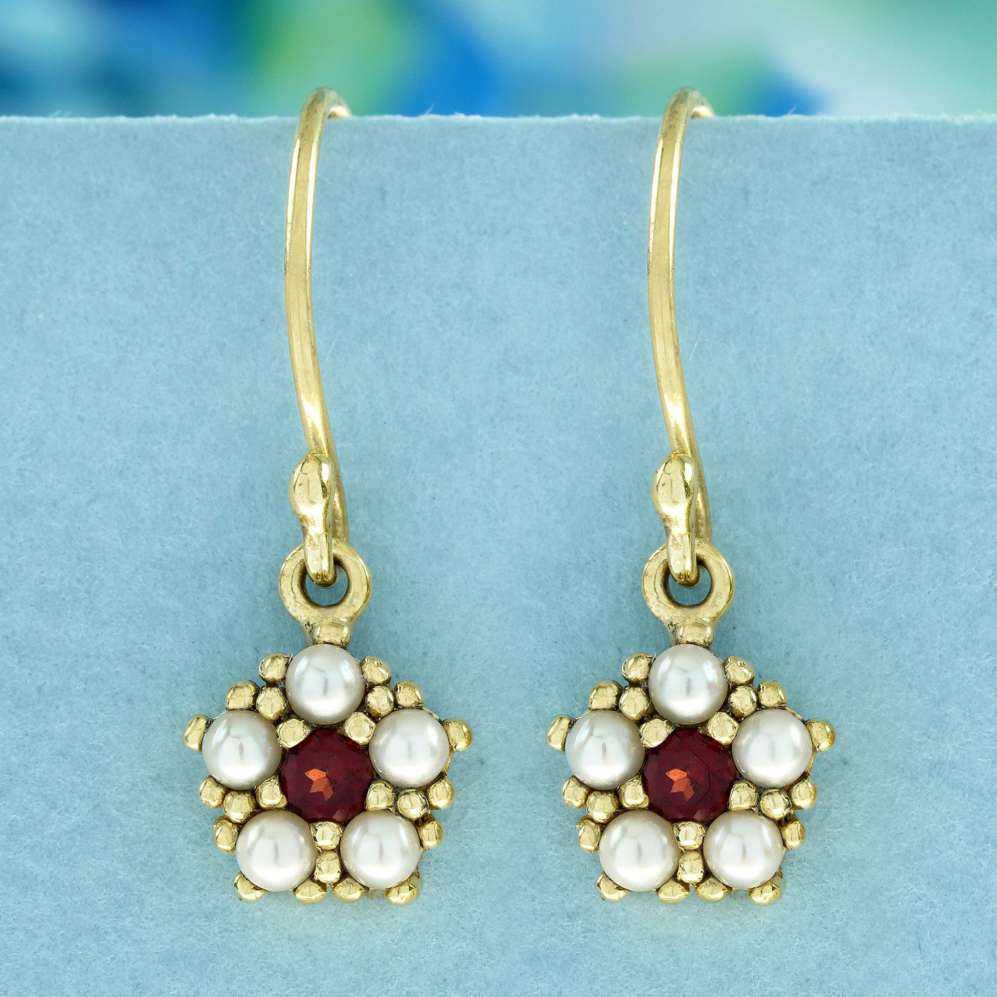Crafted in gleaming yellow gold, these earrings captivate with a unique pentagonal floral design. A single, deep red garnet, symbolizing passion and vitality, takes center stage. Delicate milgrain detailing adds a touch of vintage elegance.
