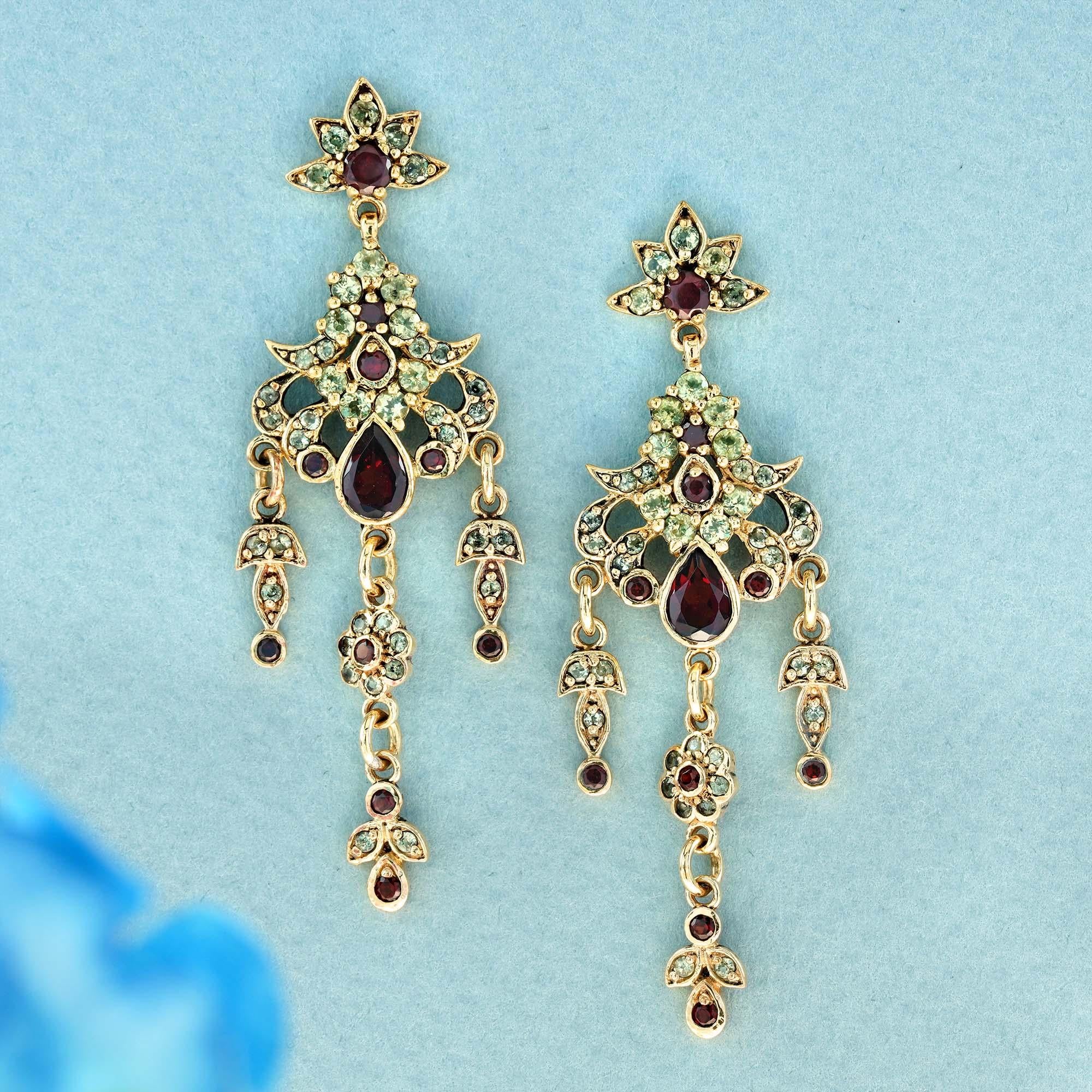 These dazzling solid yellow gold chandelier earrings are  flawlessly designed in a vintage style, showcase a cascading design of of multiple tiers of natural round and pear red garnets,  like a fine wine, and add a touch of freshness and contrast