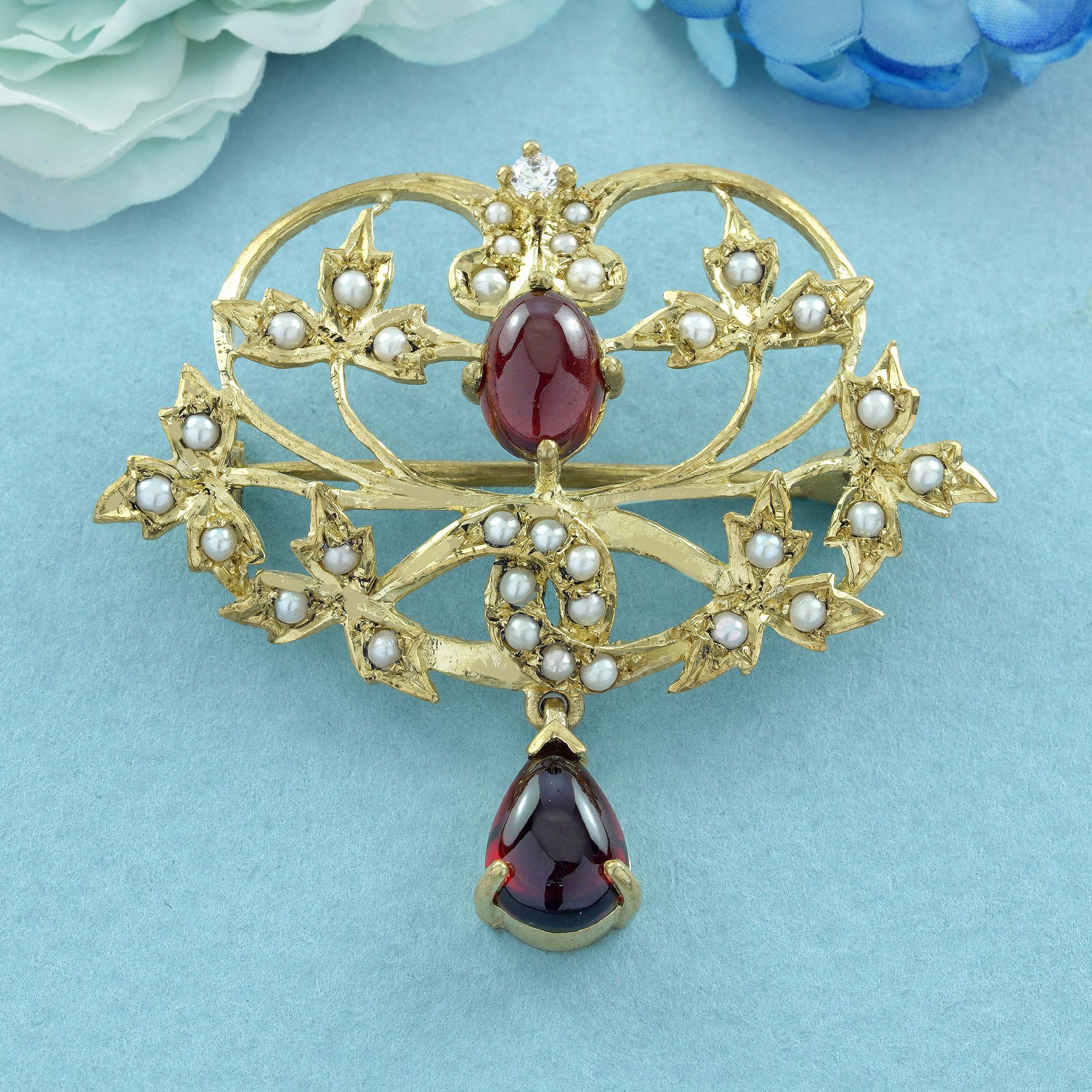 Experience the timeless beauty of our Natural Garnet Cabochon, Pearl, and Diamond Leaf & Floral Brooch, a breathtaking masterpiece in solid 9K yellow gold. This exquisite brooch captures the essence of nature’s elegance, with a stunning cabochon
