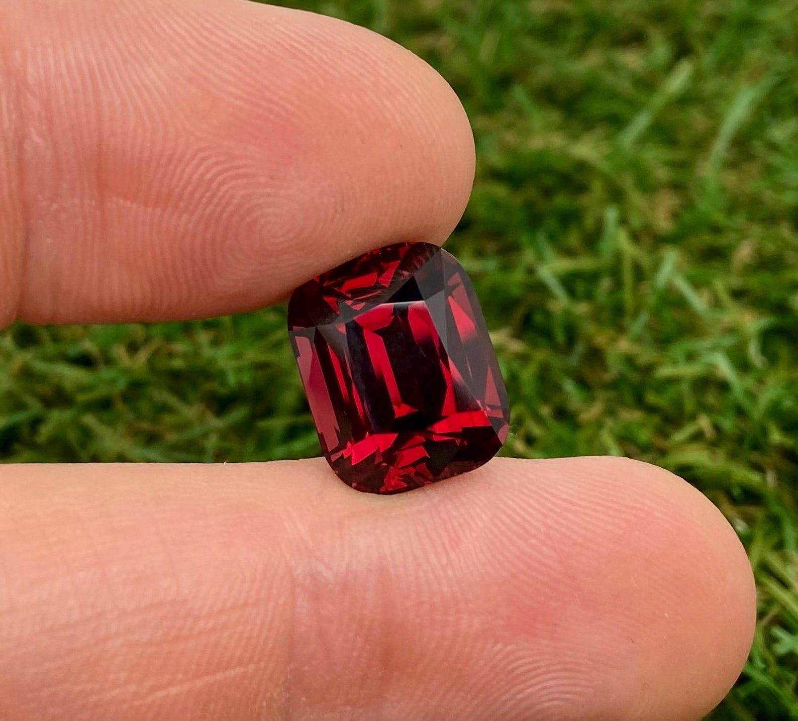 Natural Garnet Rhodolite
Loose Gemstone 13.92 ct.

Laboratory certified GFCO
Gemstone Color: purplish-RED
Gemstone Type: Garnet Rhodolite
Gemstone size: 14.56x11.75x8.66 mm
Cut Grade: Excellent
Clarity/Grade: Loupe Clean
Gemstone Shape: Cushion