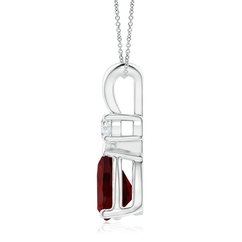 A pear-shaped intense red garnet is secured in a prong setting and embellished with a diamond accent on the top. Simple yet stunning, this teardrop garnet pendant with V bale is sculpted in platinum.
Garnet is the Birthstone for January and
