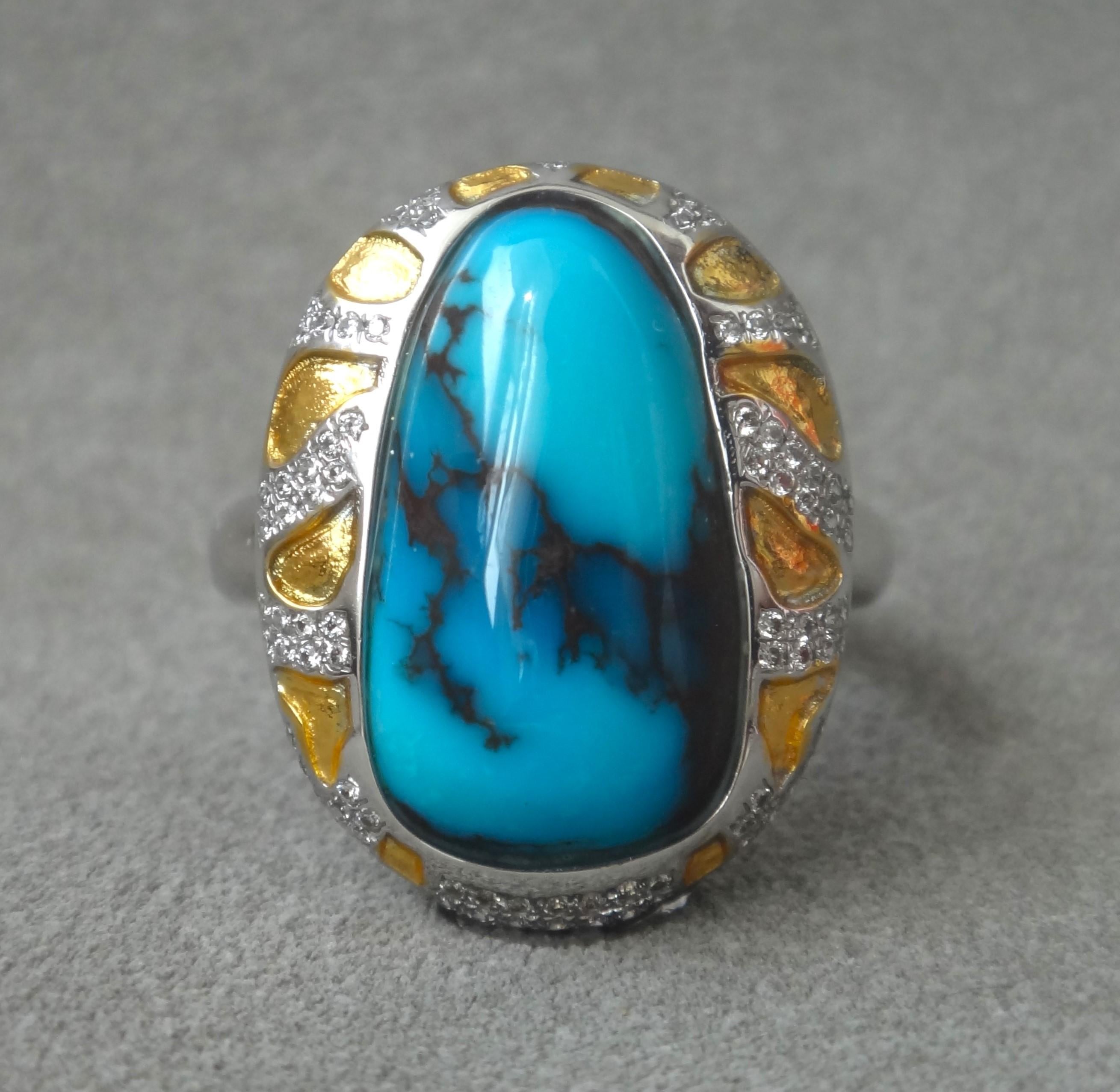 The Cocktail Ring features an exquisite and rare 12CTS oval cabochon Bisbee turquoise center stone.
In southern Arizona, the 
Lavender Pit copper mine in Bisbee is now closed. Bisbee turquoise 
varies in coloration, but most specimens are deeply