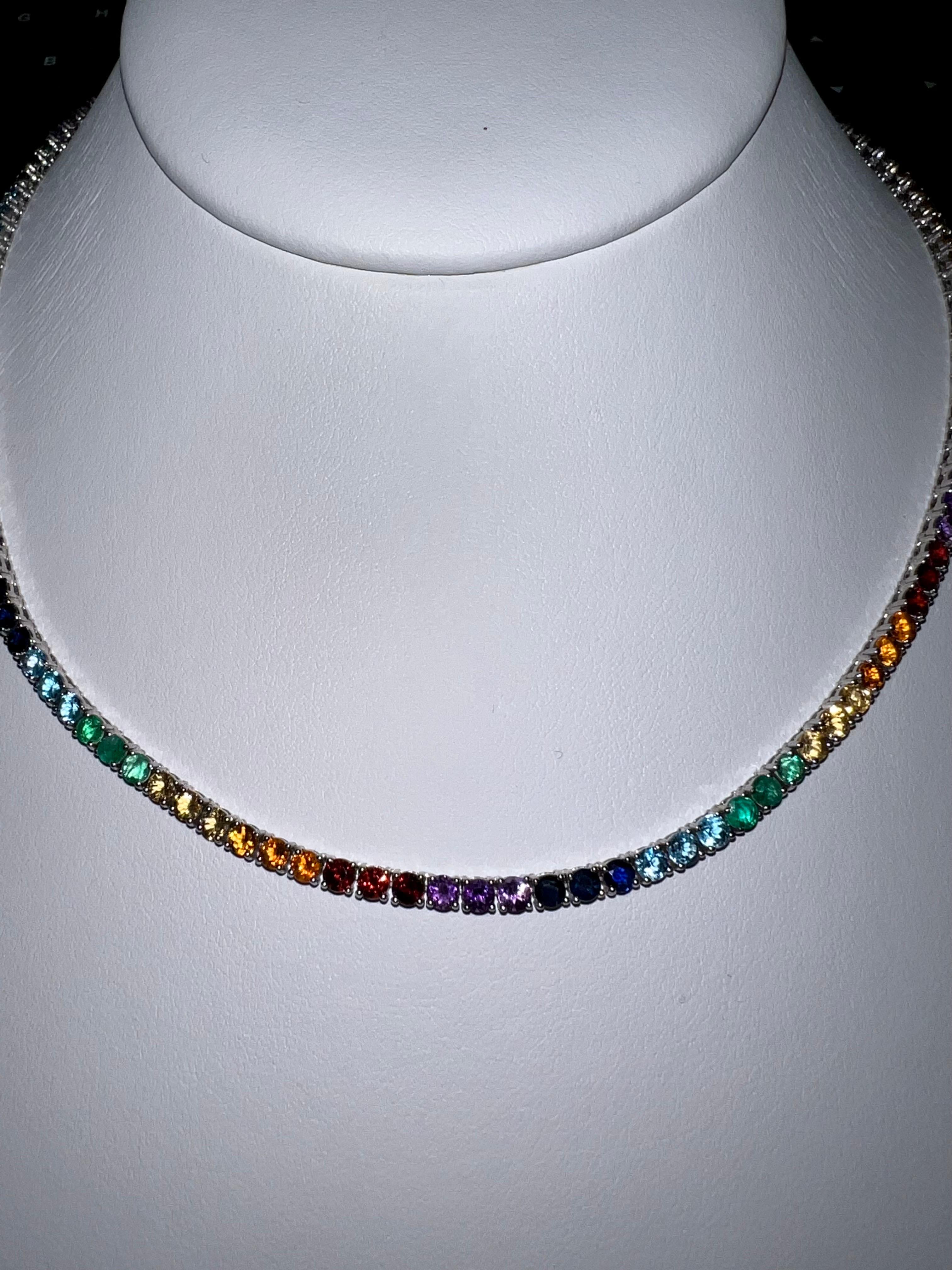 Handmade 18K White Gold Tennis Necklace with 123 Round Brilliant Cut Natural Gemstones in colors of the Rainbow: Sapphires, Emeralds, and Rubies weighting in total of 15.25 carats.
Length of the necklace is 16 inches

Viewings available in our NYC