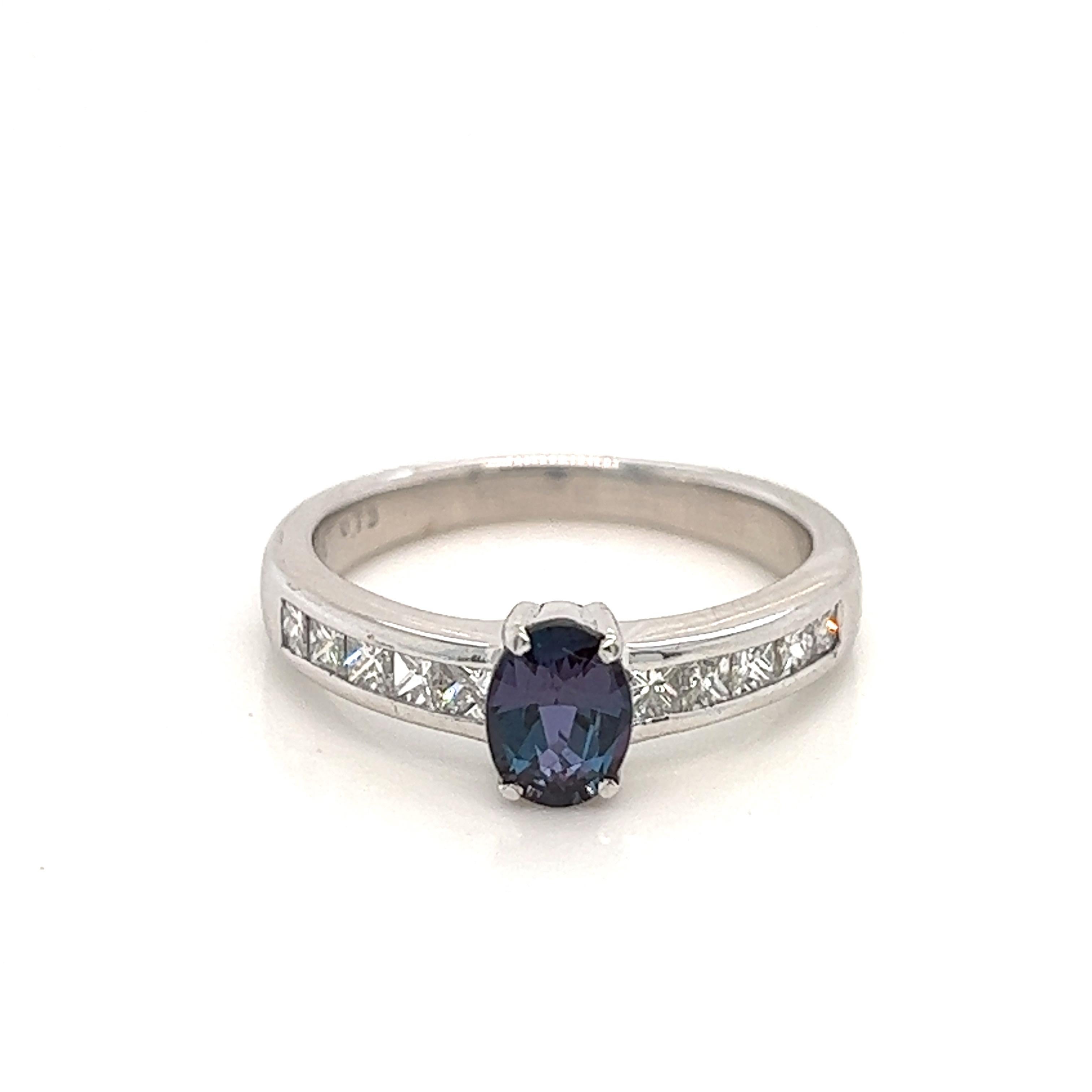 This is a gorgeous natural AAA quality oval Alexandrite surrounded by dainty diamonds that is set in a vintage platinum setting. This ring features a natural 0.73 carat oval alexandrite that is certified by the Gemological Institute of America (GIA)