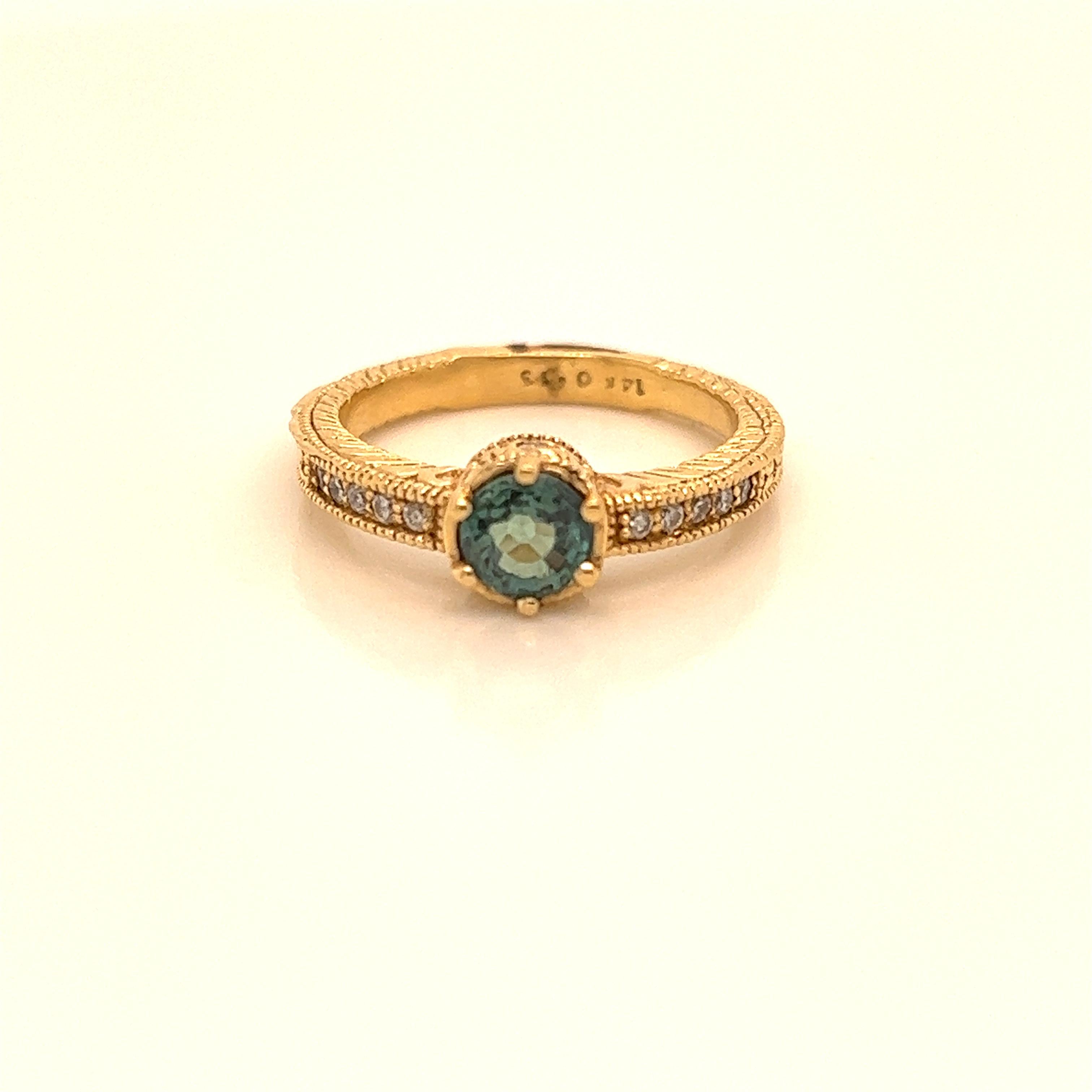 This is a gorgeous natural AAA quality Round Alexandrite surrounded by dainty  diamonds that is set in solid 14 Yellow Gold Ring. This ring features a natural 0.77carat round alexandrite that is certified by the Gemological Institute of America