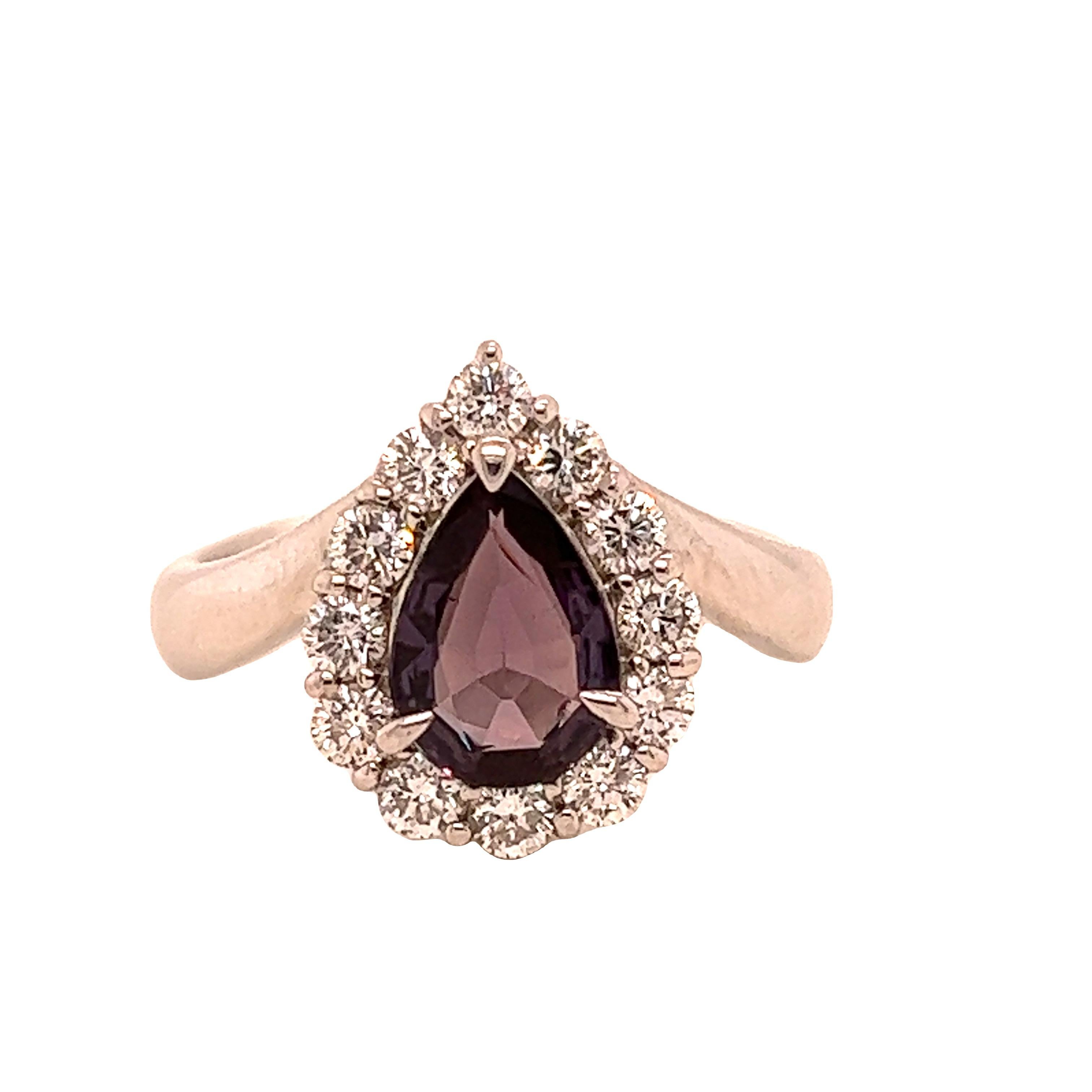 This is a gorgeous natural AAA quality pear Alexandrite surrounded by dainty diamonds that is set in a vintage platinum setting. This ring features a natural 1.08 carat pear alexandrite that is certified by the Gemological Institute of America (GIA)