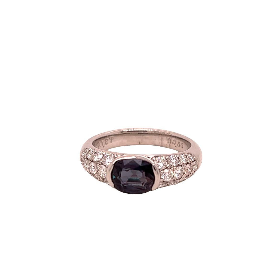 This is a gorgeous natural AAA quality oval Alexandrite surrounded by dainty diamonds that is set in a vintage platinum setting. This ring features a natural 1.27 carat oval alexandrite that is certified by the Gemological Institute of America (GIA)