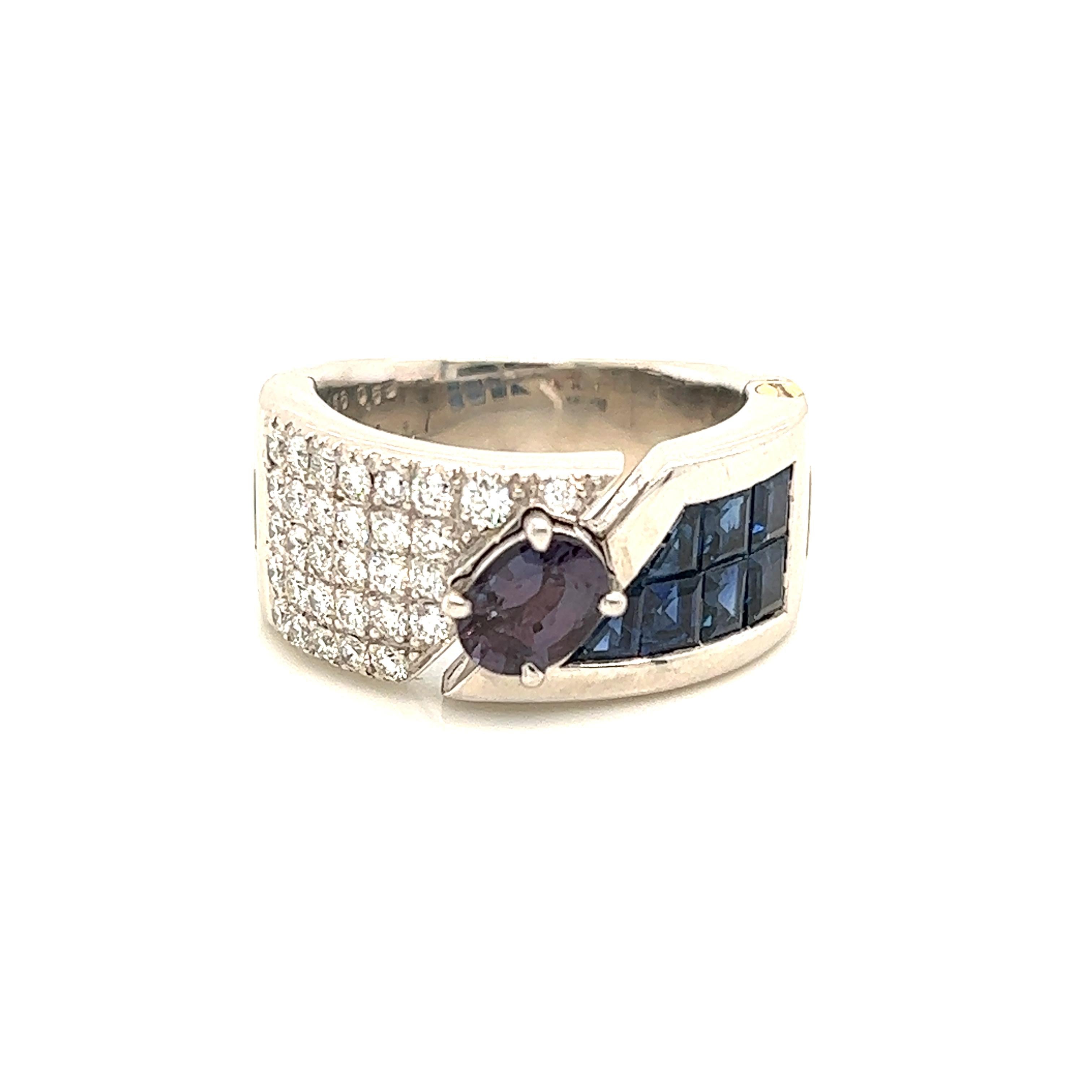 This is a gorgeous natural AAA quality oval Alexandrite surrounded by a dainty diamond halo that is set in a vintage platinum setting on one side and sapphire on the other side. This ring features a natural 1.69 oval alexandrite that is certified by