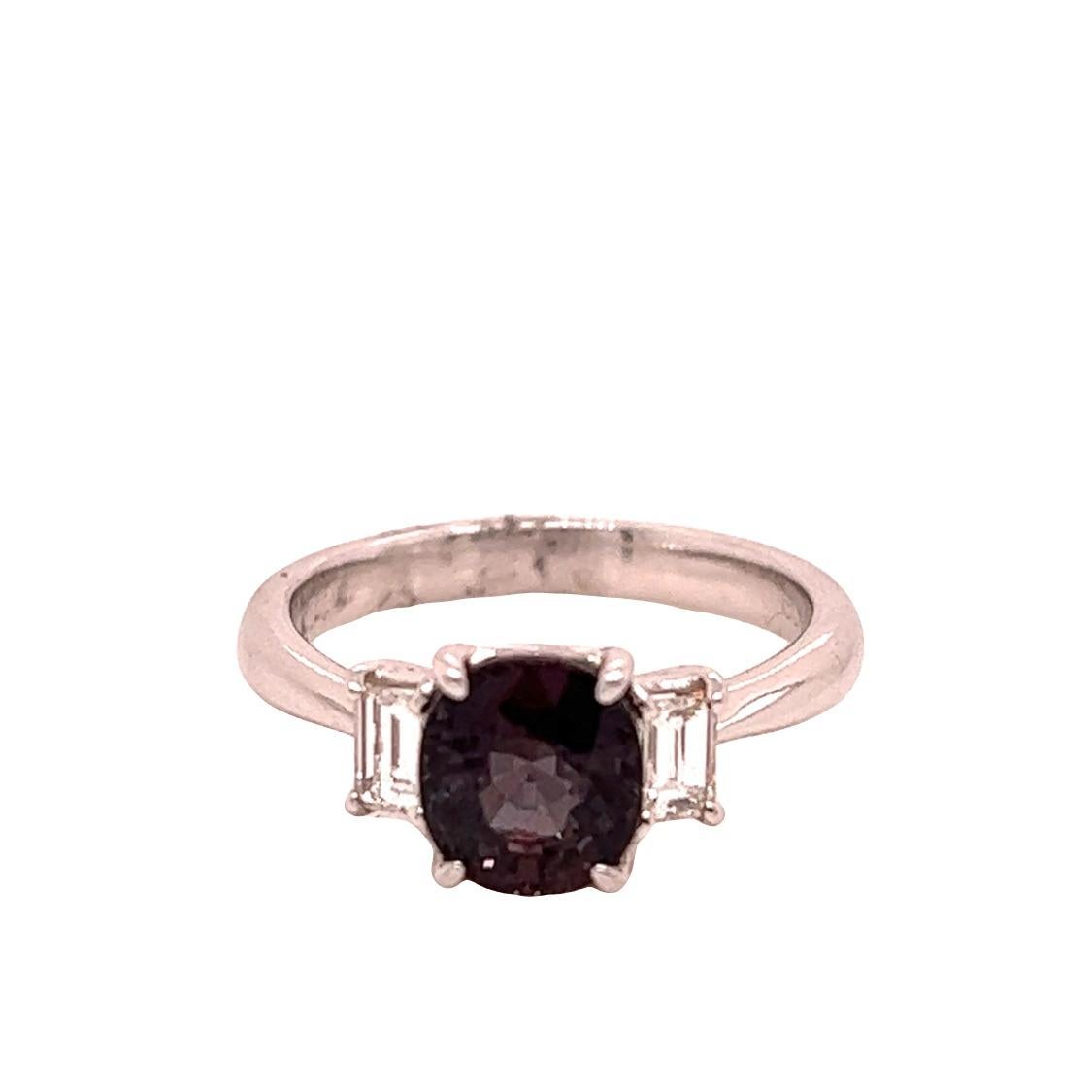 This is a gorgeous natural AAA quality oval Alexandrite set in a vintage platinum setting. This ring features a natural Brazilian 2.21 carat oval Alexandrite that is certified by the Gemological Institute of America (GIA). The ring is a true