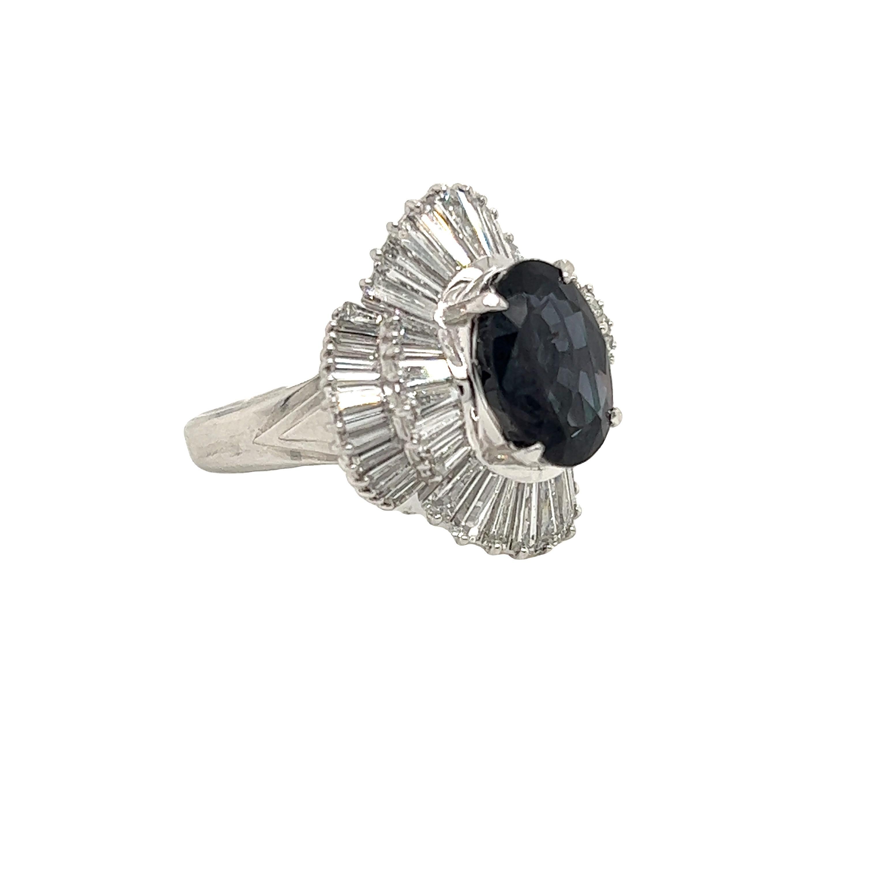 This is a gorgeous natural AAA quality oval Alexandrite surrounded by dainty diamonds that is set in a vintage platinum setting. This ring features a natural 4.34 carat oval alexandrite that is certified by the Gemological Institute of America (GIA)