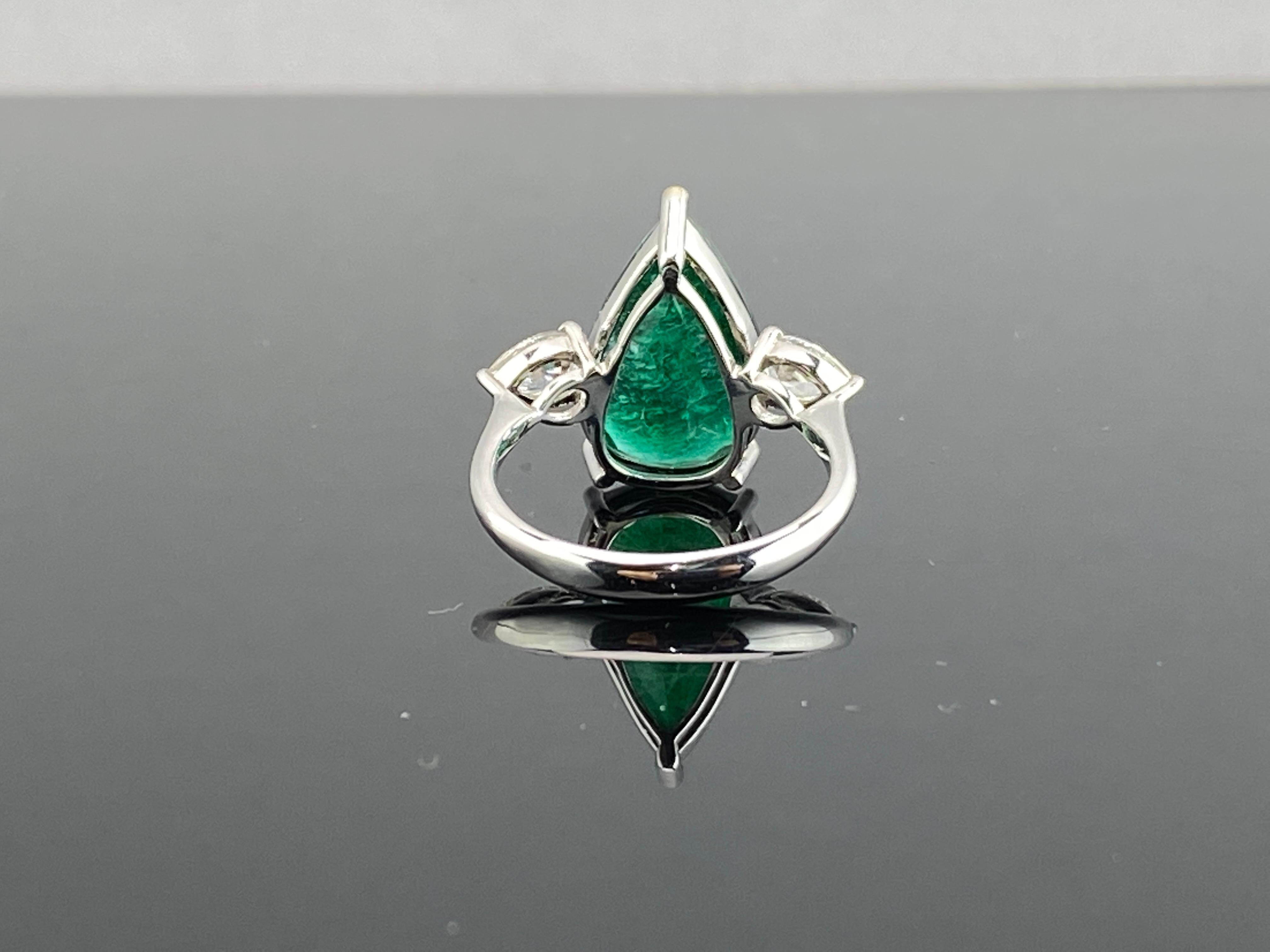 Modern Certified 5.7 Carat Pear Emerald Diamond Three Stone Engagement Ring For Sale