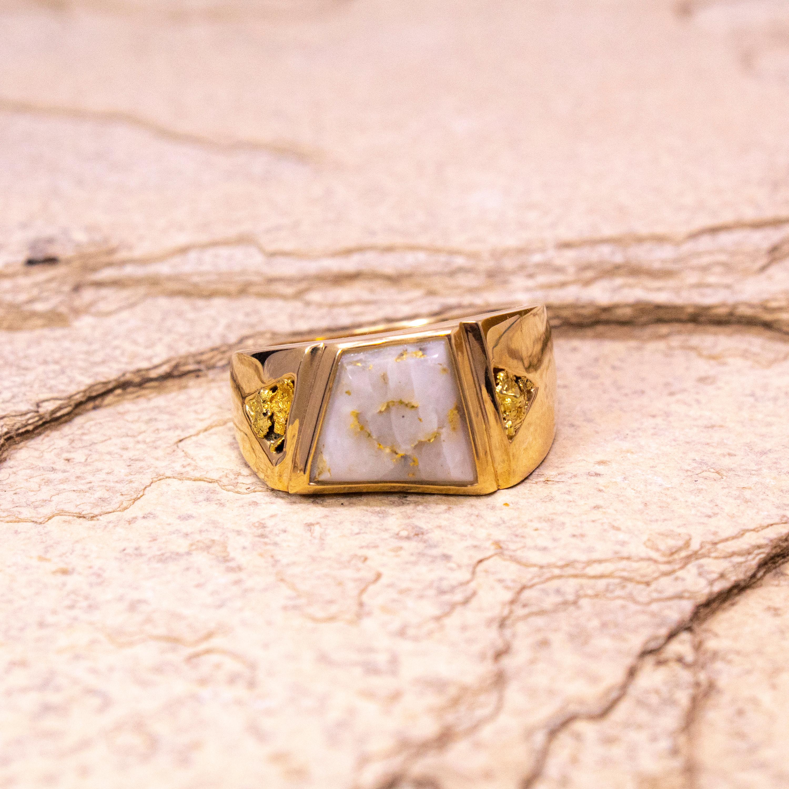 This asymmetrical men's ring features rare natural gold bearing quartz accented by natural gold nuggets. The modern, trapezoidal shape is an unexpected (but perfect) frame for these natural materials. The vivid colors of the raw gold pop