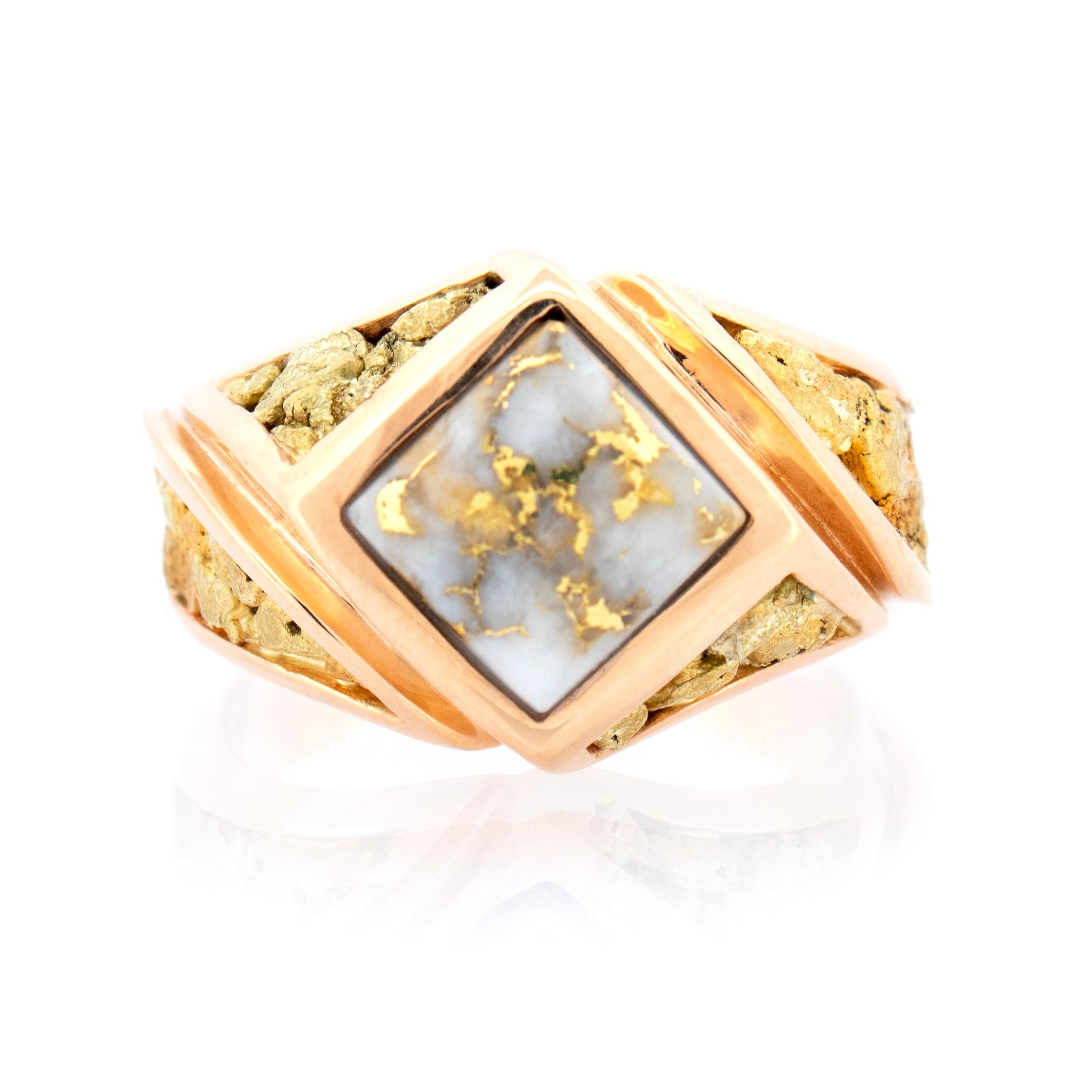 The unexpectedly elegant style of this men's ring presents exquisitely rare natural gold bearing quartz as well as natural gold nuggets. The color of the two types of natural raw gold pop dramatically against the 14kt setting. This substantially