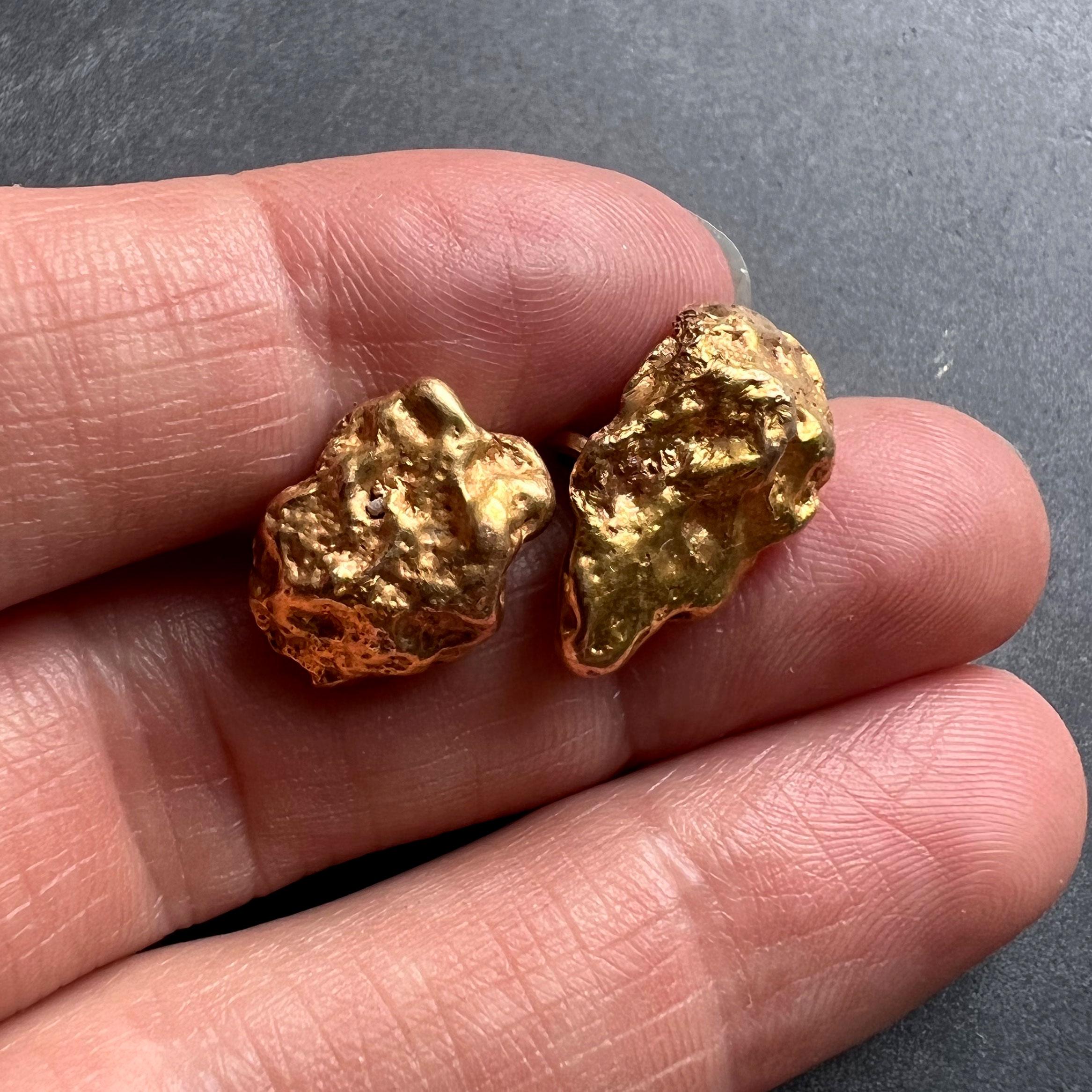 A pair of natural gold nuggets set as a pair of cufflinks with 18K (18 karat) yellow gold links. Natural quartz crystal embedded in one nugget. Stamped with the owl mark for French import and 18 karat gold with an unknown maker’s mark.

Dimensions: