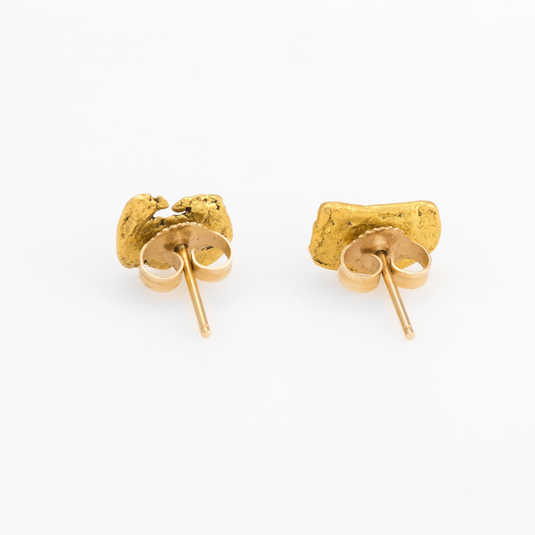 Elegant pair of vintage natural gold nugget earrings (24k gold nuggets and 14k gold backings). 

The natural mined from the earth gold nuggets are attached to the 14 karat yellow gold backings. The gold nuggets have their own unique organic look