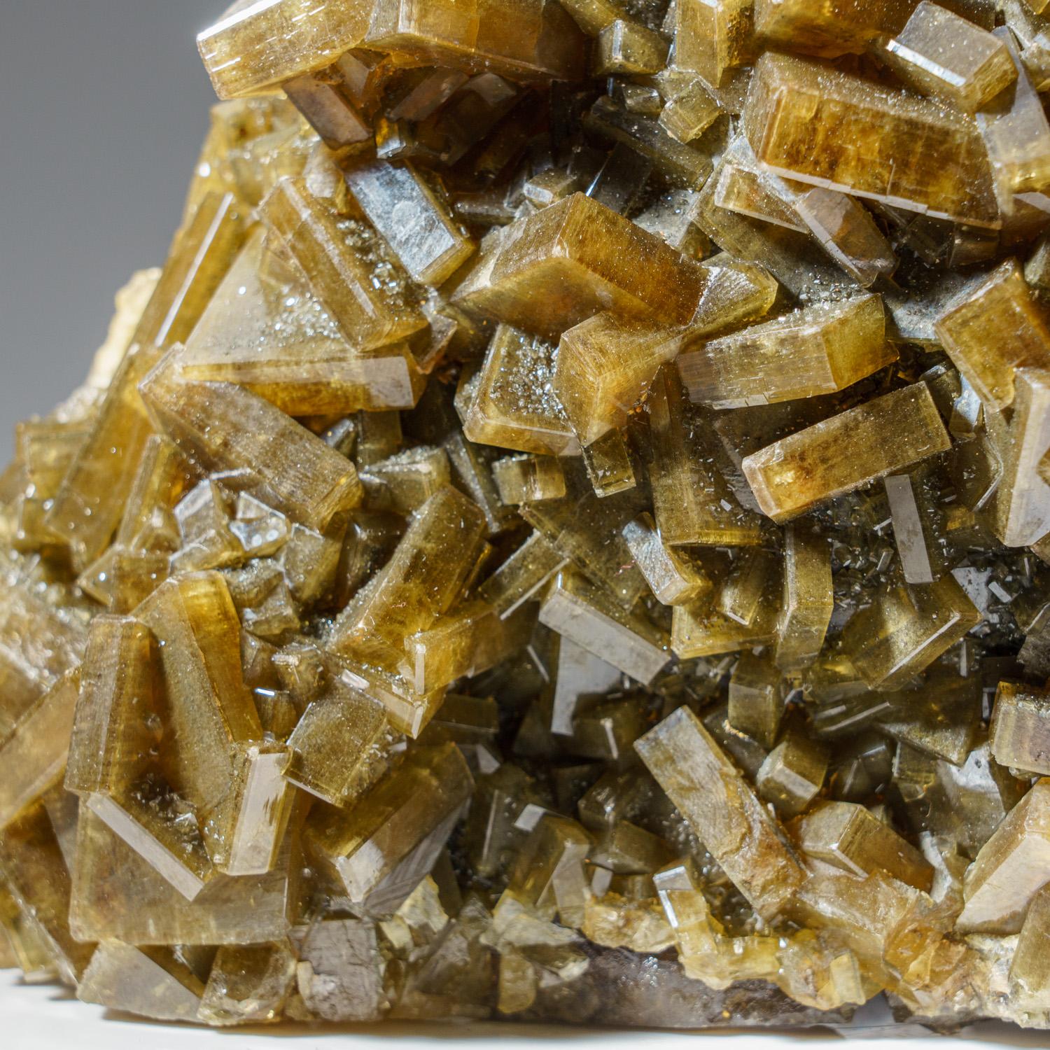 From Nandan County, Hechi, Guangxi, China

Large plate of golden barite crystals to covers all sides, with minimal attachment point on matrix.

 Weight: 4.5 lbs, Dimensions: 6 x 2 x 5 inches.