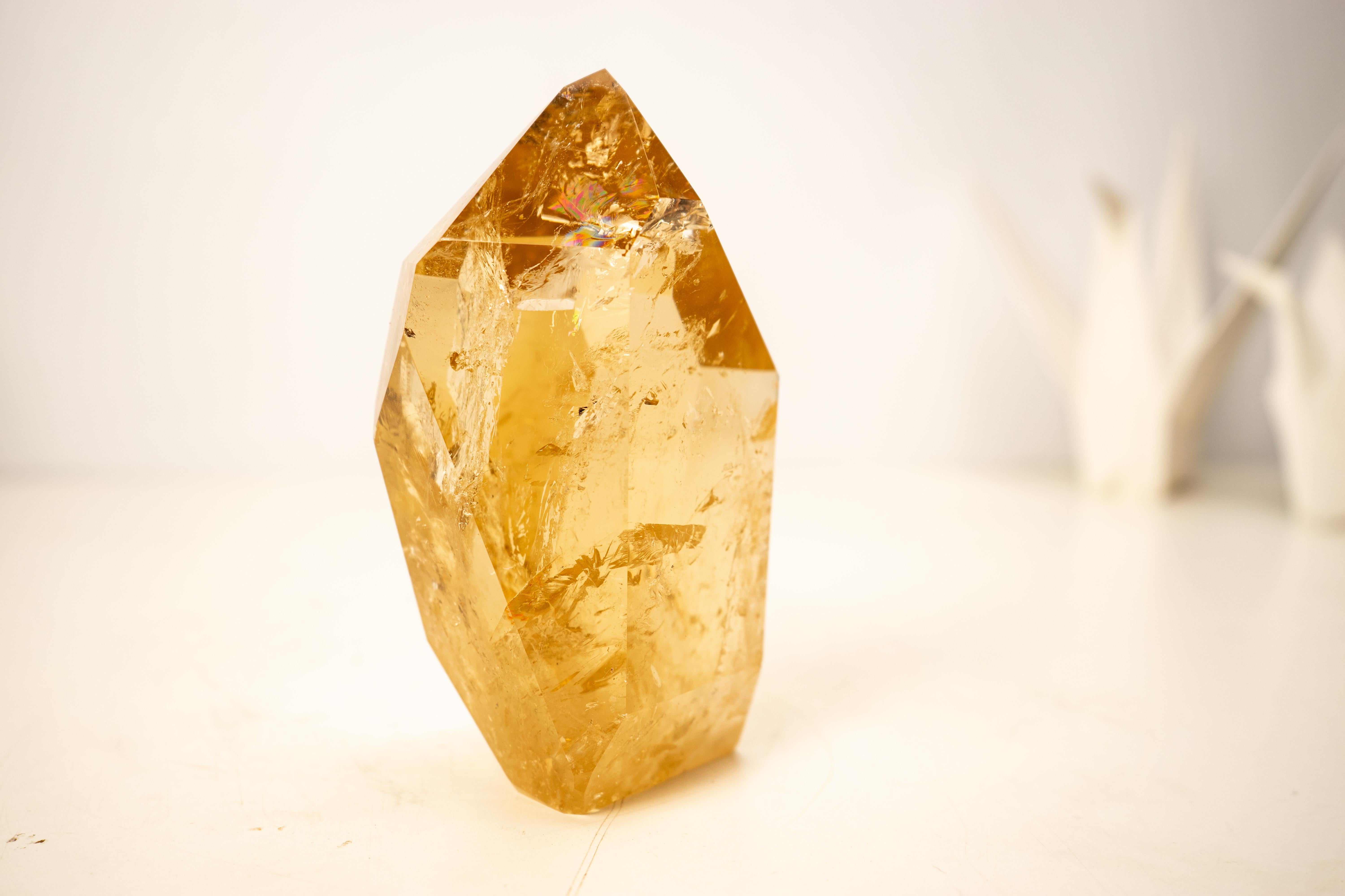 Genuine High-Grade Golden Orange Citrine

▫️ Description

With gorgeous aesthetics that combine a world-class golden-orange color, refined lapidary work, and natural brilliance, this citrine crystal from Araçuaí, Brazil showcases exceptional