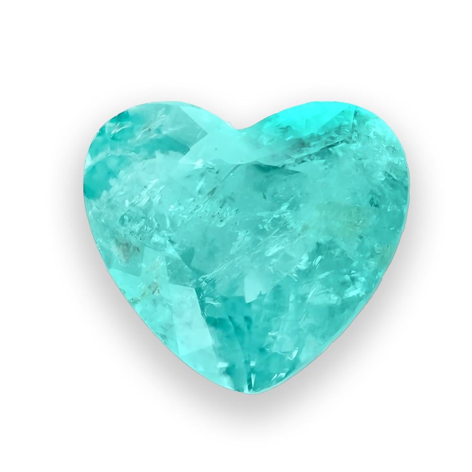Discover the enchanting charm of this natural Brazilian Paraiba tourmaline, weighing 2.49 carats. Cut in a romantic heart shape, this gem features a captivating green-blue hue that radiates brilliance and depth—perfect for a statement piece that