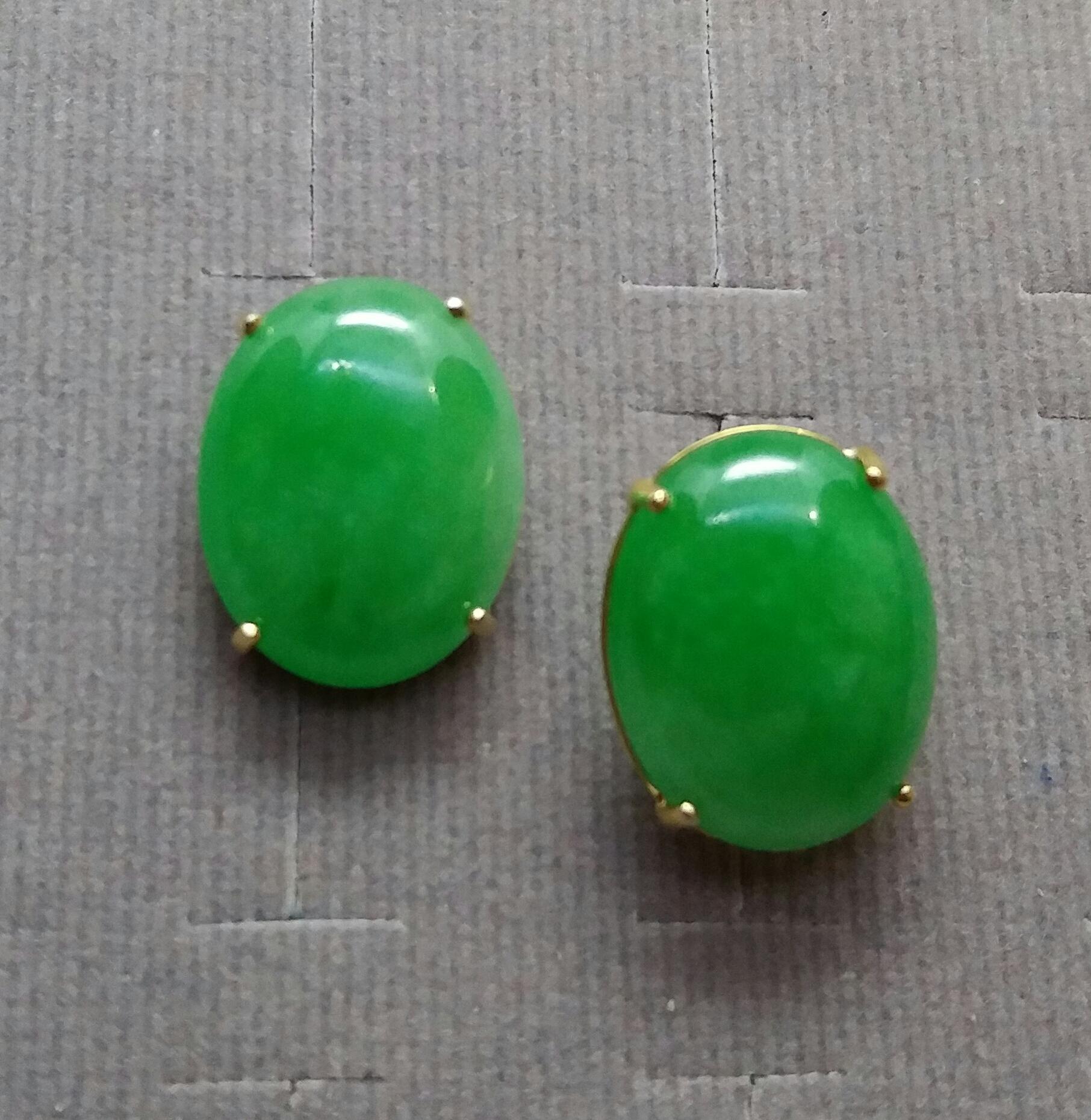 Simple and elegant pair of Jade Oval Cabochons measuring 17x13 mm. in  a 14 Kt yellow gold prongs setting.

In 1978 our workshop started in Italy to make simple-chic Art Deco style jewellery, completely handmade and using the typical gemstones of