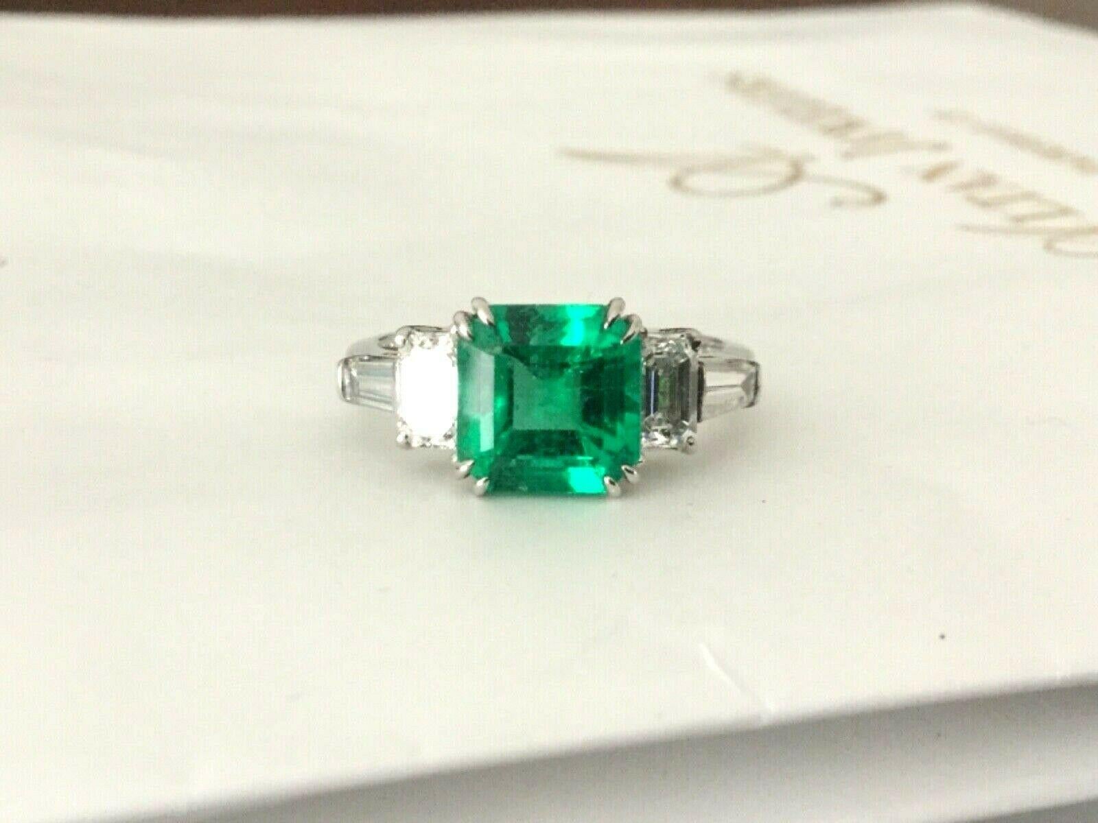 For your consideration is a 2.15 carat octagonal shaped, natural, transparent, green emerald set in a brand new 14k white gold setting with 1.00 carats of natural G color VS clarity white diamonds.  The unheated emerald is GIA certified and is super