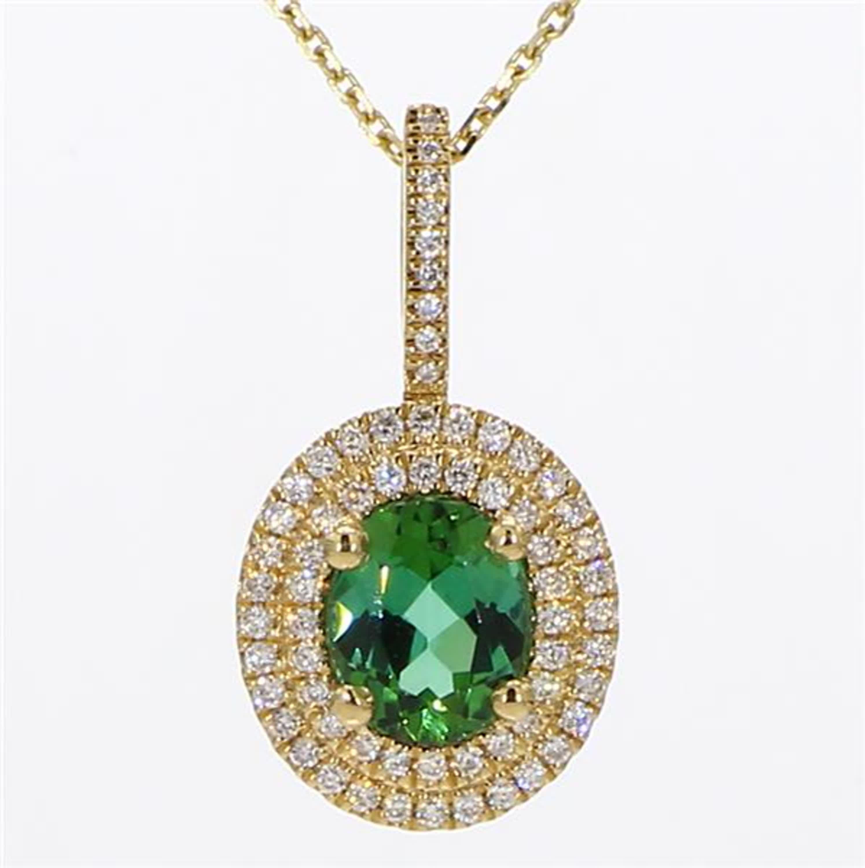 RareGemWorld's intriguing tourmaline pendant. Mounted in a beautiful 14K Yellow Gold setting with natural oval cut green tourmaline. The tourmaline is surrounded by natural round white diamond melee. This pendant is guaranteed to impress and enhance