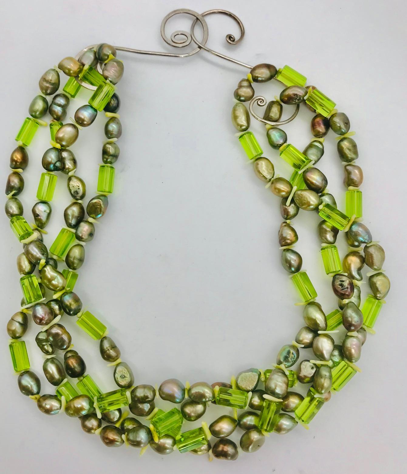 Green Pearls and green natural faceted 10 mm Peridot beads with silver clasps. White branch coral  spacer. 68