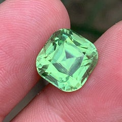 Natural Green Peridot 8.15 Ct Cushion Cut Gemstone with Black Needle Inclusions