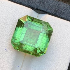Natural Green Peridot with Ludwigite Inclusions 14.60 Ct Emerald Cut Loose Gem