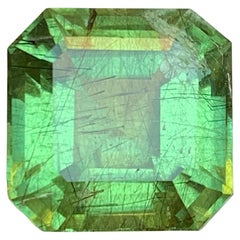 Natural Green Peridot with Ludwigite Inclusions 14.60 Ct Emerald Cut Loose Gem