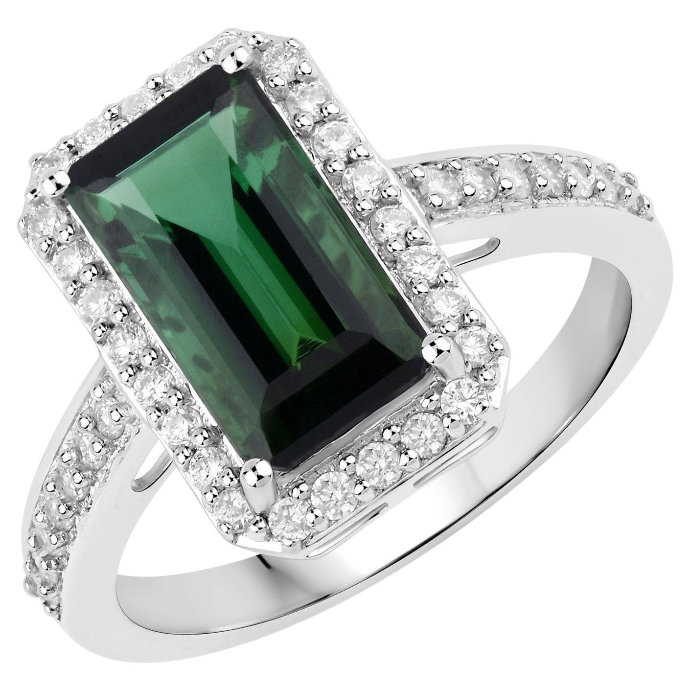 It comes with the appraisal by GIA GG/AJP
Green Tourmaline = 2.65 Carat ( 11.5 x 6.5 mm )
Cut: Emerald
Diamonds = 0.40 Carats
Diamonds Quantity: 40
Metal: 14K White Gold
Ring Size: 7* US
*It can be resized complimentary