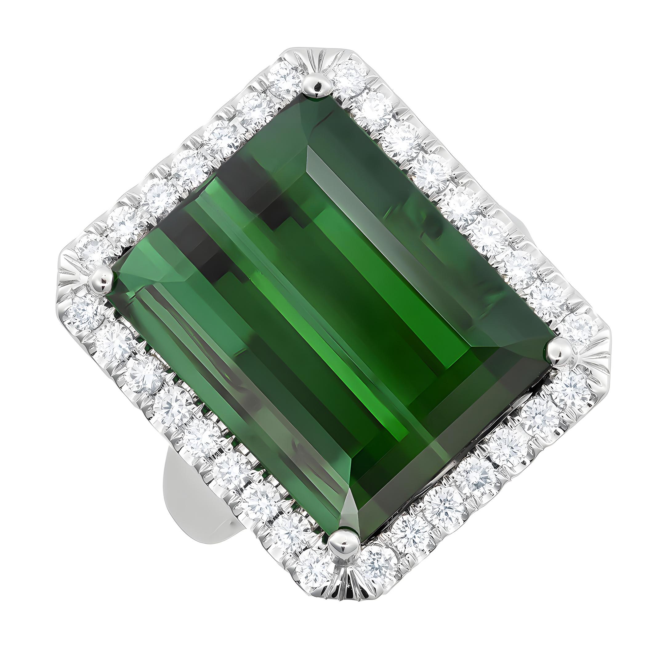 Experience the captivating allure of natural green tourmaline with this exquisite 14K white gold ring. Complemented by sparkling diamonds, this piece showcases exceptional craftsmanship and the vibrant beauty of these precious gemstones. Perfect for