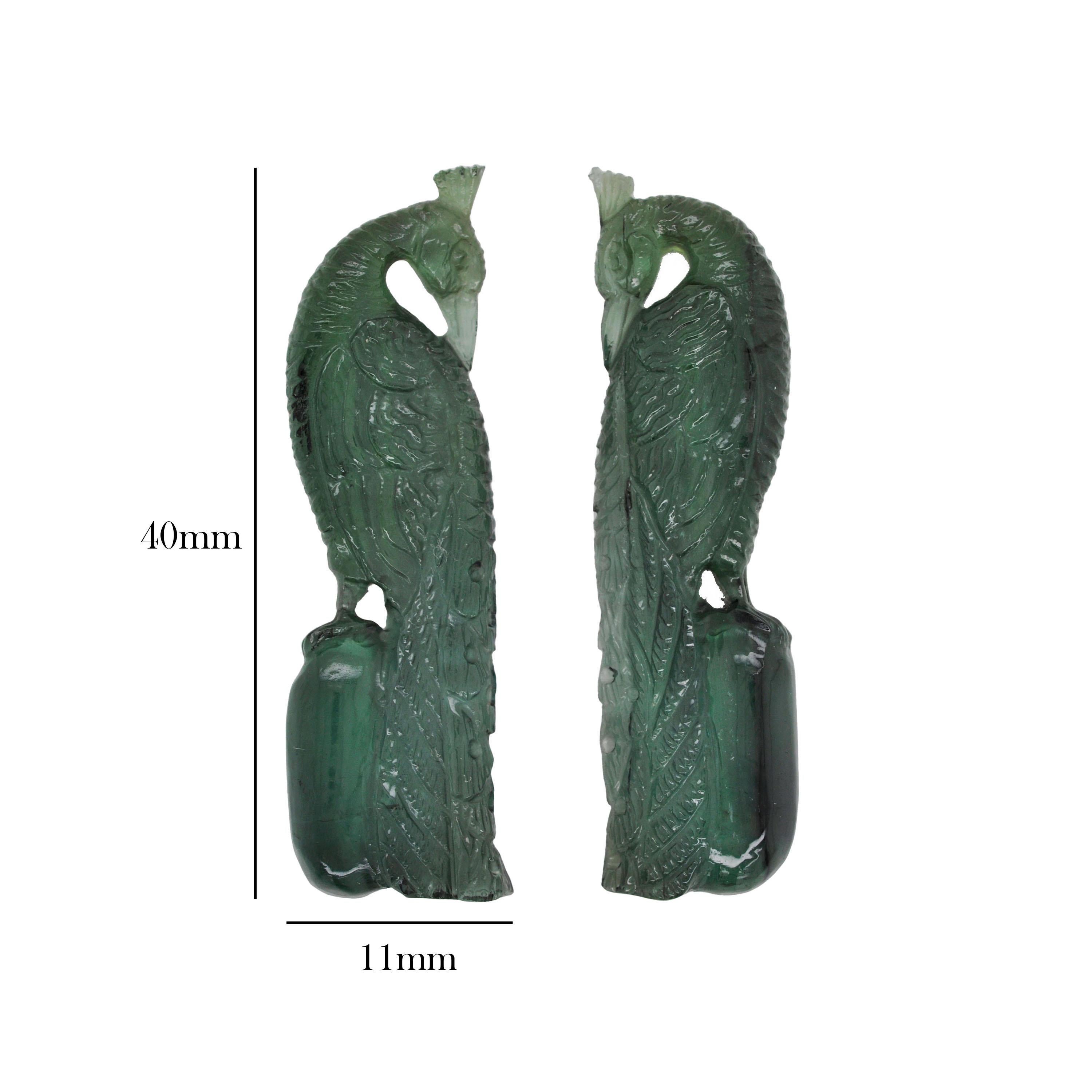 Natural green tourmaline peacock pair loose gemstones for cocktail ring earrings

The green tourmaline peacock carvings are an exceptional testament to the beauty of nature and the artistry of sculptural craftsmanship. Each carving, crafted from