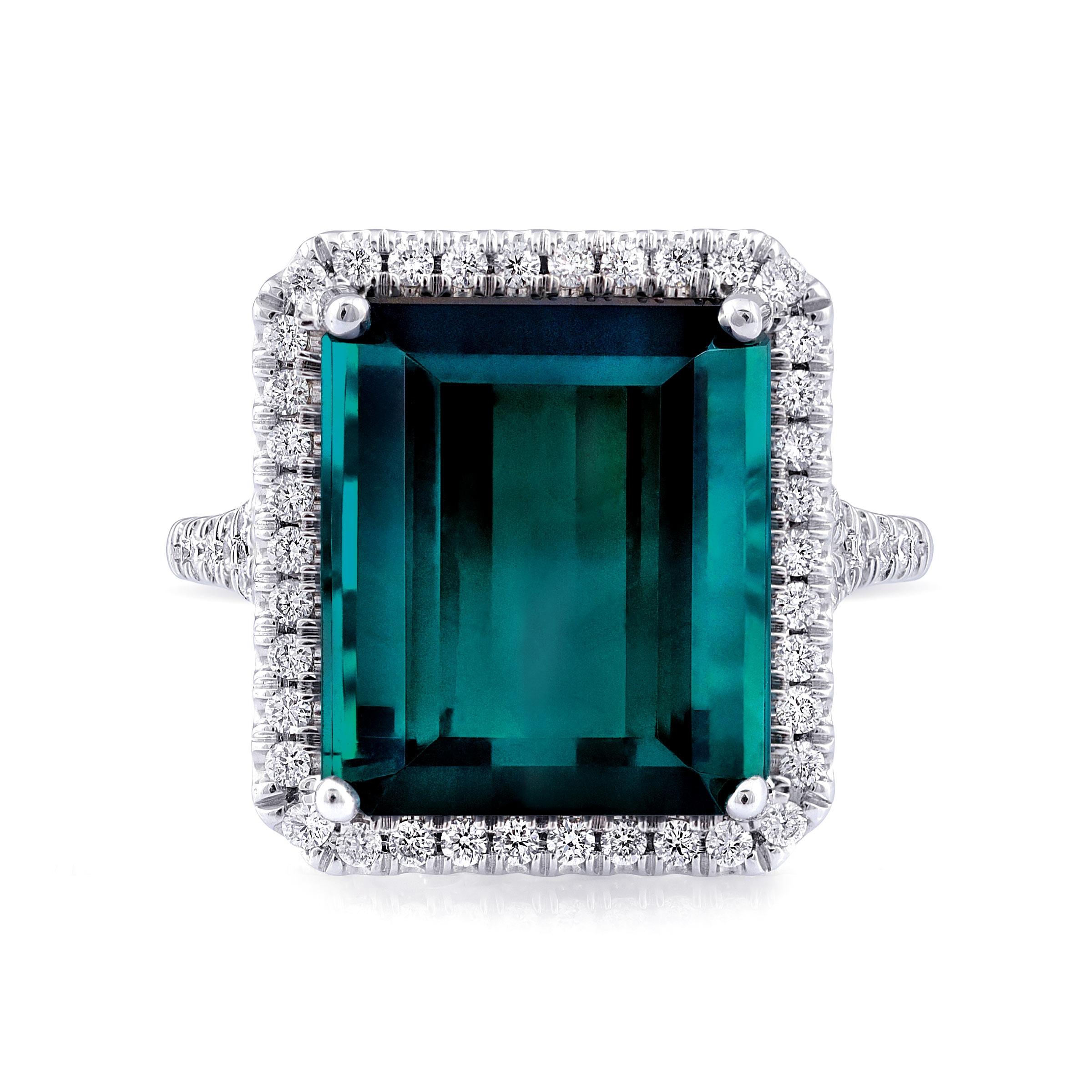 Experience the mesmerizing beauty of natural blue-green tourmaline with this exquisite 14K white gold ring. Complemented by sparkling diamonds, this piece showcases exceptional craftsmanship and the vibrant beauty of these precious gemstones.