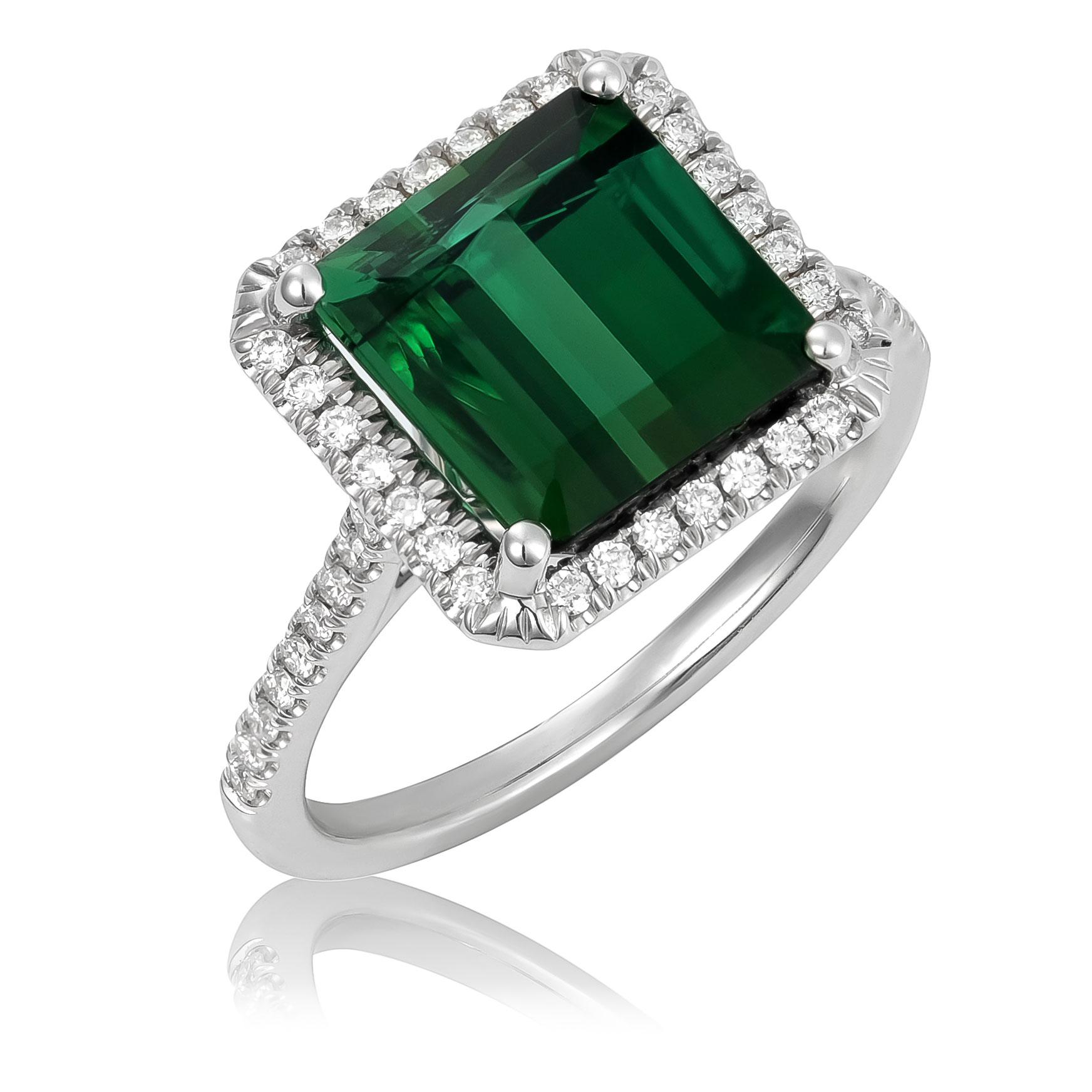 Experience the elegance of this 14K white gold ring, centered with a vivid natural green tourmaline weighing 3.36 carats. The octagonal-cut gemstone shows a strong green color with exceptional, very eye-clean clarity, making it a striking focal