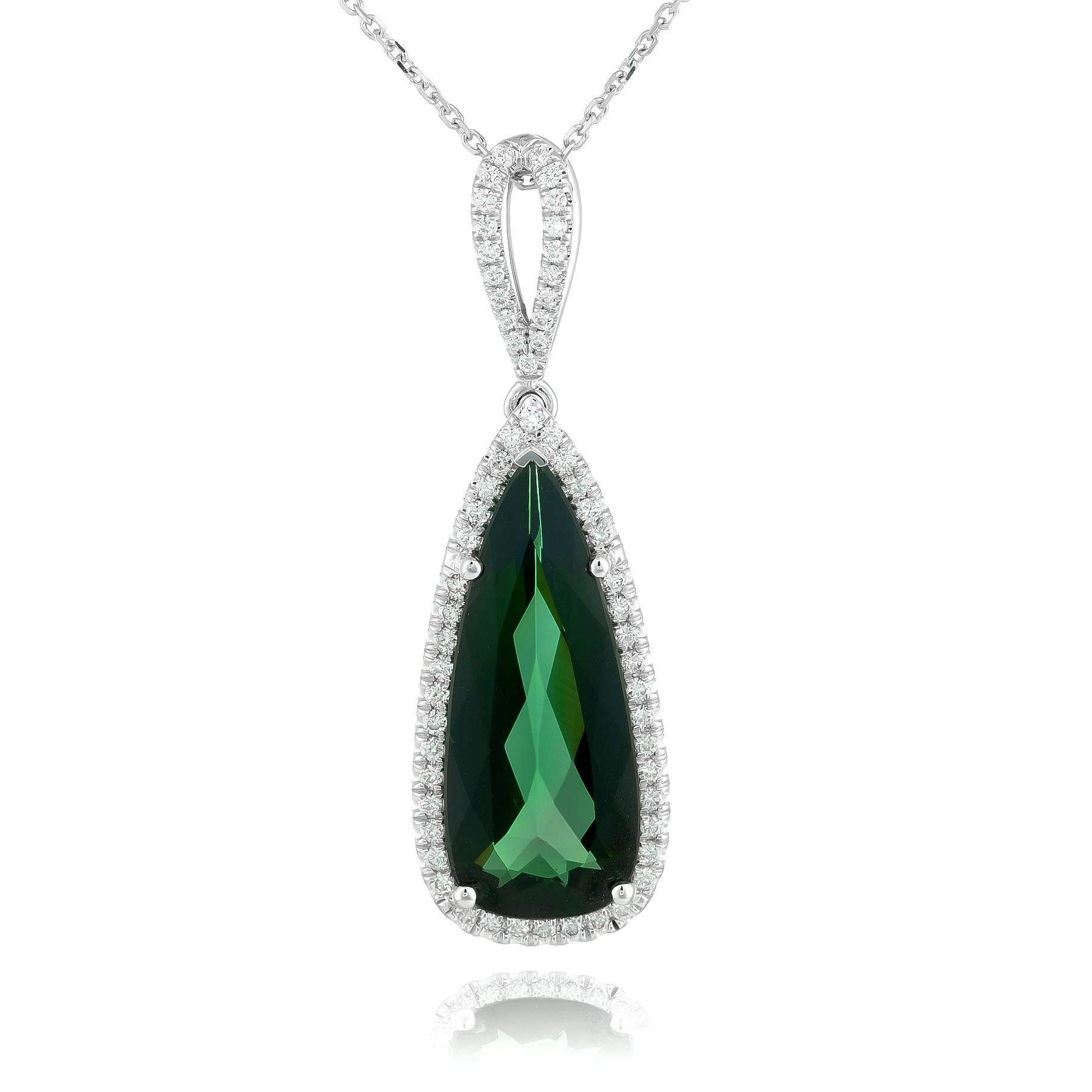 Discover the striking elegance of this 14K white gold pendant, featuring a mesmerizing 6.25-carat natural green tourmaline, beautifully accented by brilliant diamonds. The deep green hue of the pear-shaped tourmaline, paired with sparkling diamonds,