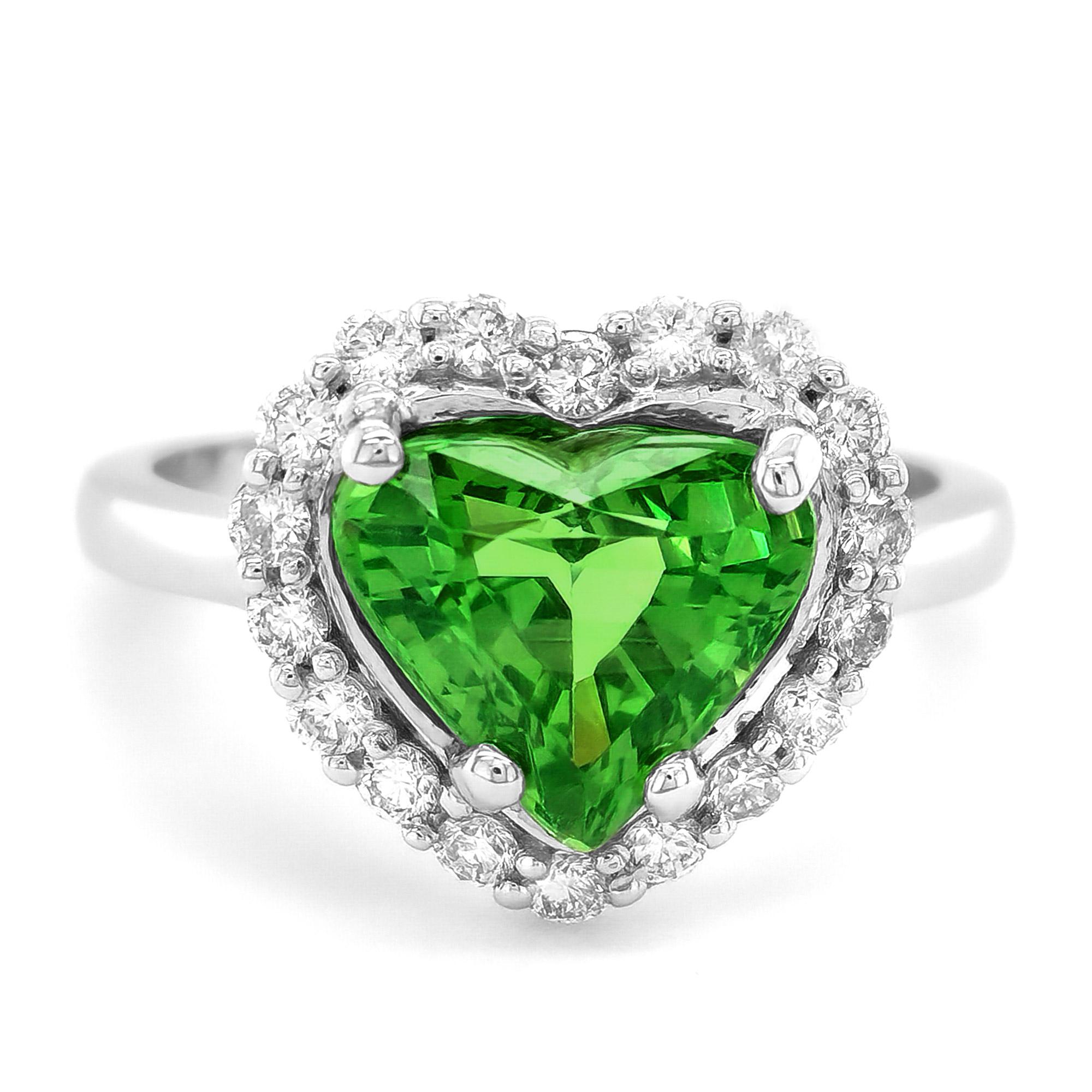Elevate your jewelry collection with the mesmerizing allure of natural tsavorite in this stunning 18K white gold ring. Accentuated by sparkling diamonds, this exquisite piece combines exceptional craftsmanship with the vibrant beauty of these