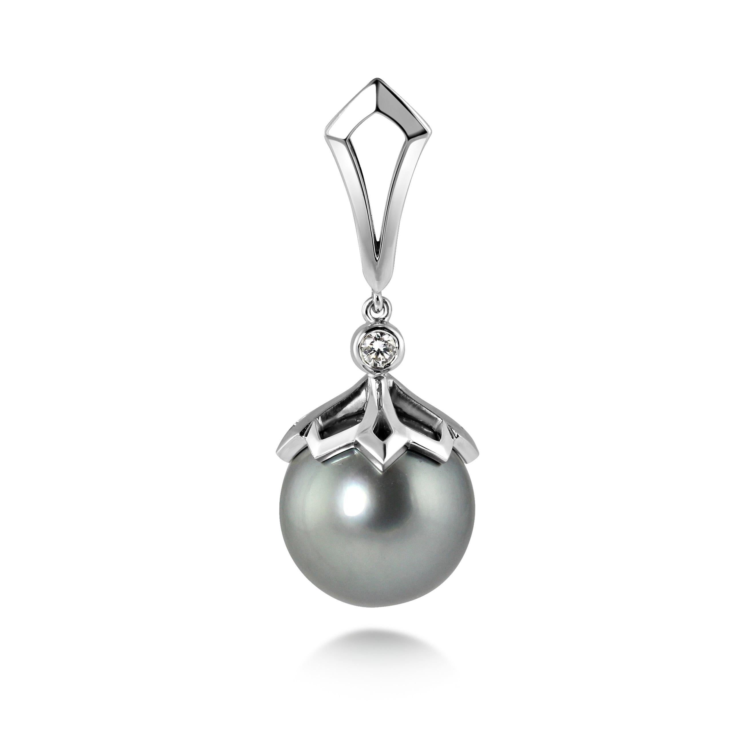 These stunning natural grey Tahitian Pearls are held in a beautifully pierced cap with a diamond top. 

The earrings are articulated above the diamond, allowing them movement when worn. 

A matching pendant and ring are available, please see our