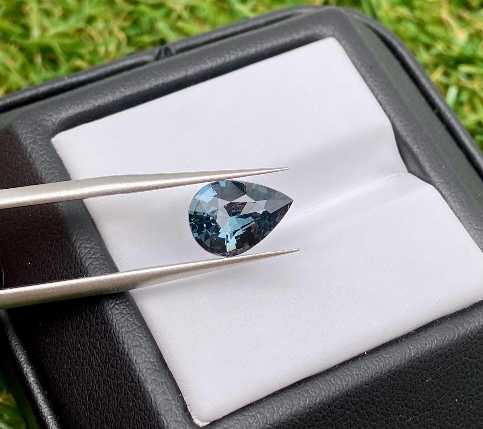 Natural Greyish-Blue Spinel gemstone from Tanzania

GFCO Laboratory certified
Gemstone Color: Greyish-Blue
Gemstone Type: Spinel
Gemstone size: 10.60x7.51x4.37 mm
Cut Grade: Excellent
Clarity/Grade: Loupe Clean
Gemstone Shape: Pear Cut
Gemstone