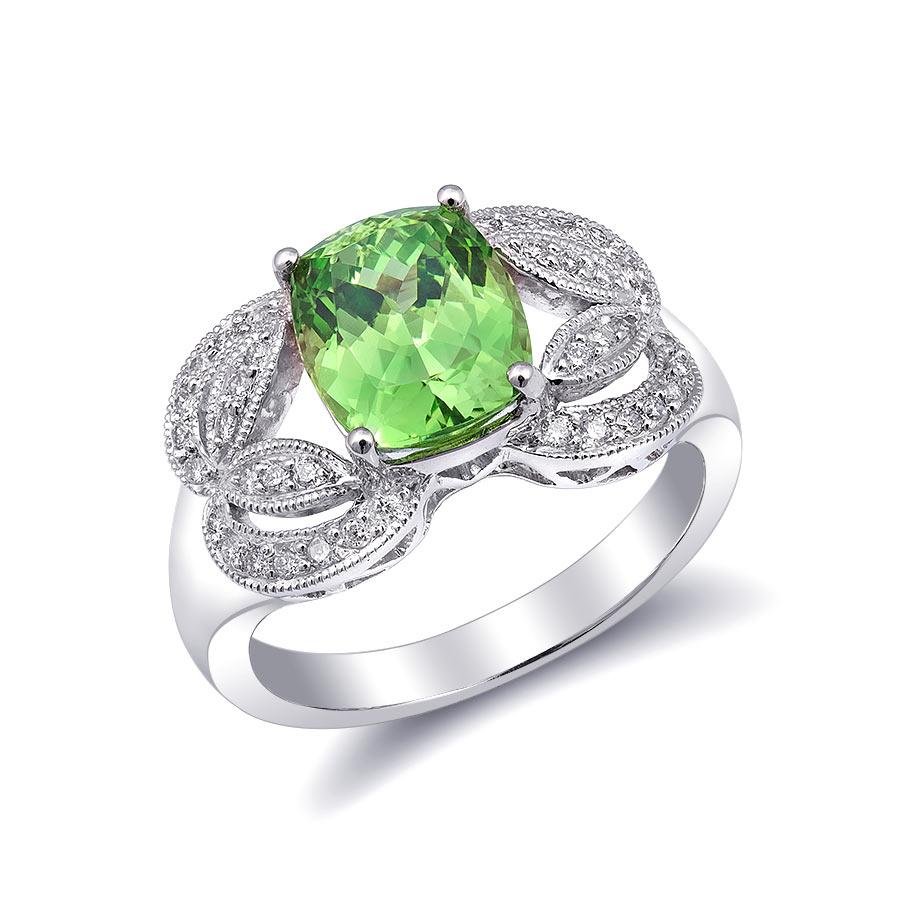 Discover elegant 18K white gold ring features a stunning natural grossular garnet as its centerpiece. The rich color of the garnet, combined with sparkling round diamonds, creates a luxurious and eye-catching design. Perfect for both special