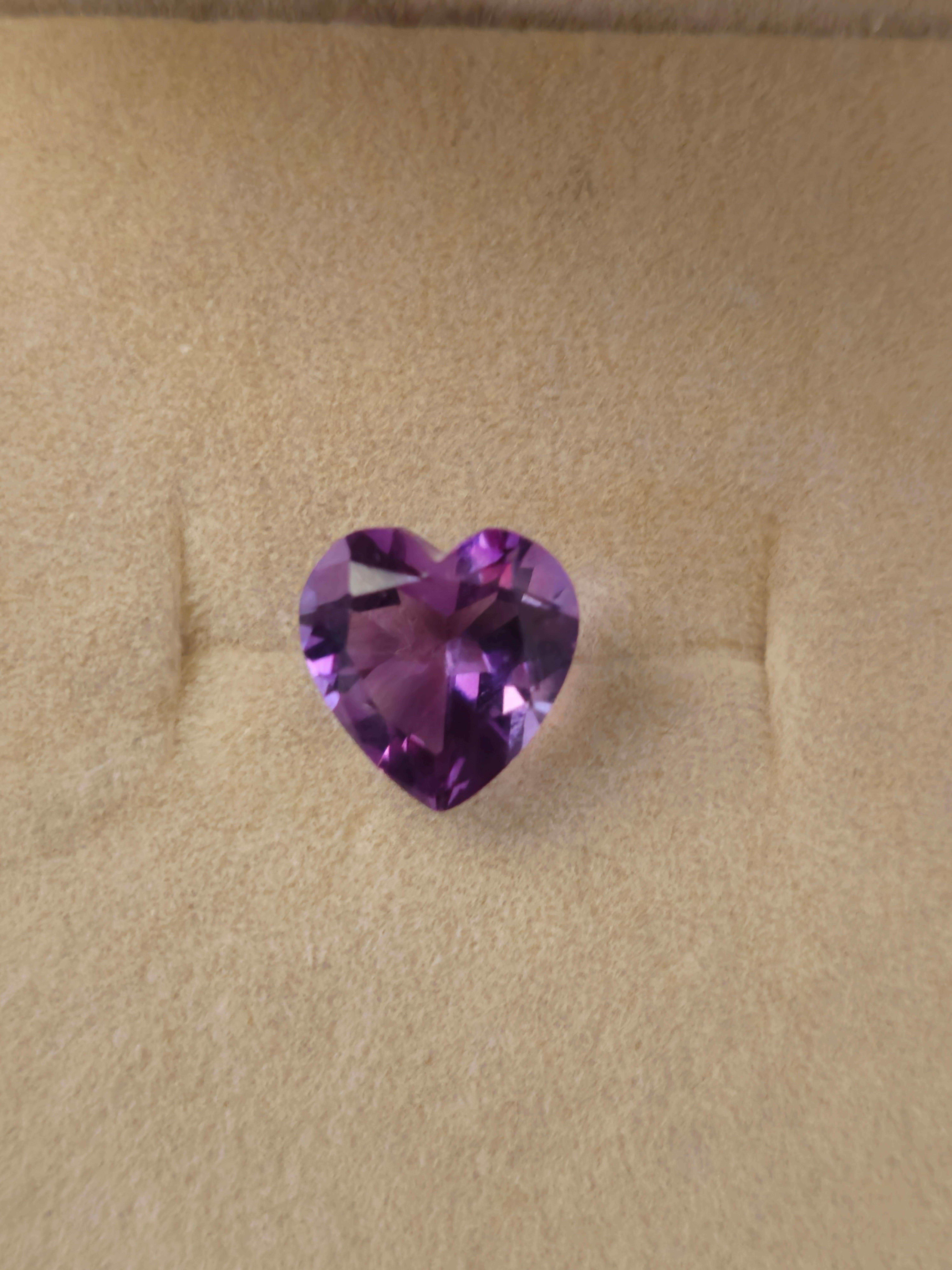 Embrace the beauty of natural Amethyst with this exquisite 2 CT heart-shaped gemstone. Sourced from Brazil, the gemstone measures 8mm in width and 8mm in length, displaying a fantasy cut that enhances its stunning appearance. The rich purple hue and