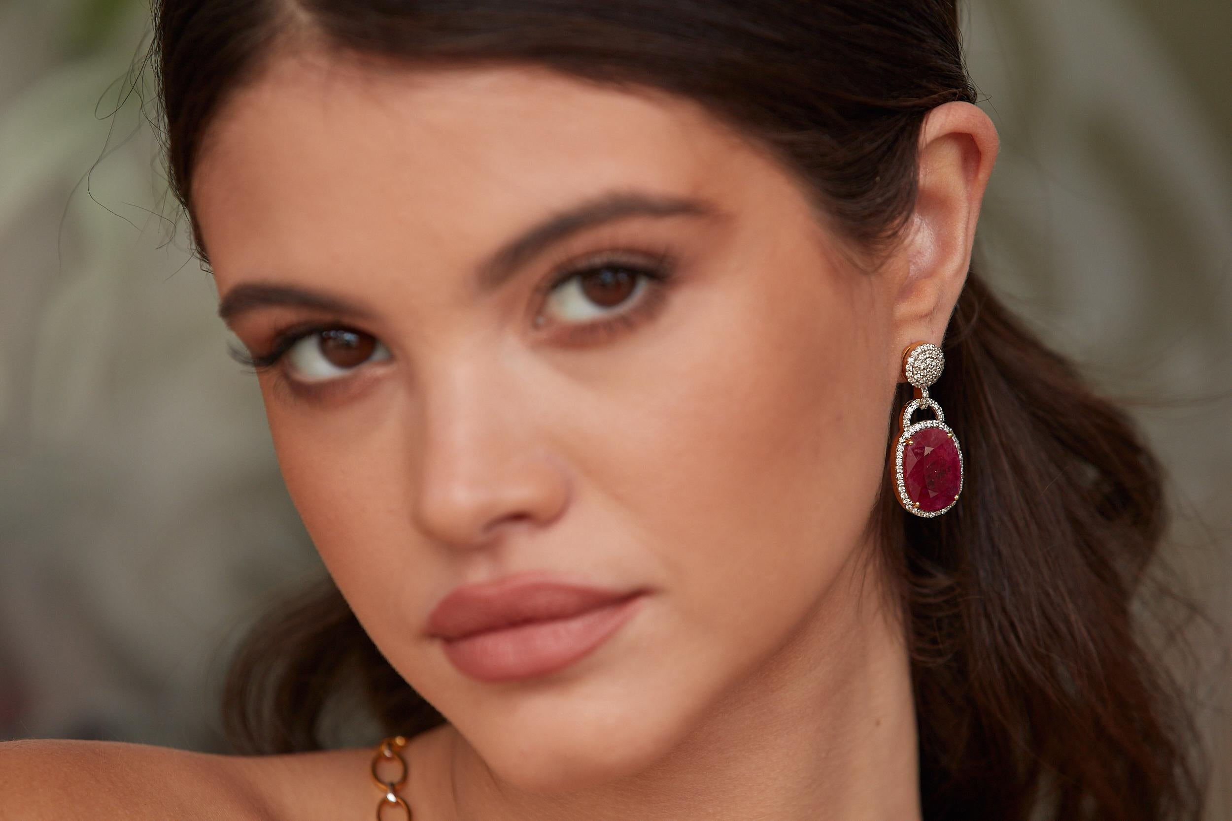 Tresor Diamond Earring features 0.79 cts diamond and 27.71 cts Ruby in 18k white gold. The Earring are an ode to the luxurious yet classic beauty with sparkly diamonds. Their contemporary and modern design makes them versatile in their use. The