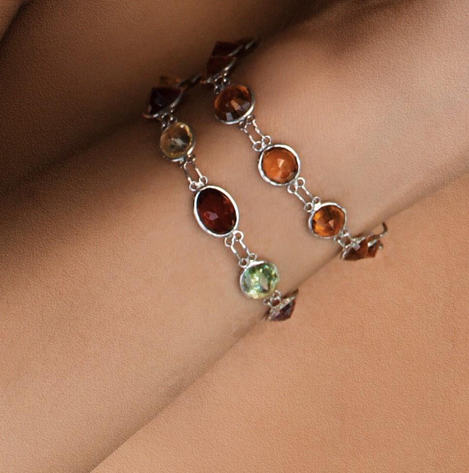 Introducing our Natural Hessonite Garnet Tennis Bracelet, an exquisite piece of fine jewelry that radiates warmth and elegance in its most sought after brown orange color. This bracelet is a stunning collection of 13 carefully chosen 1-carat