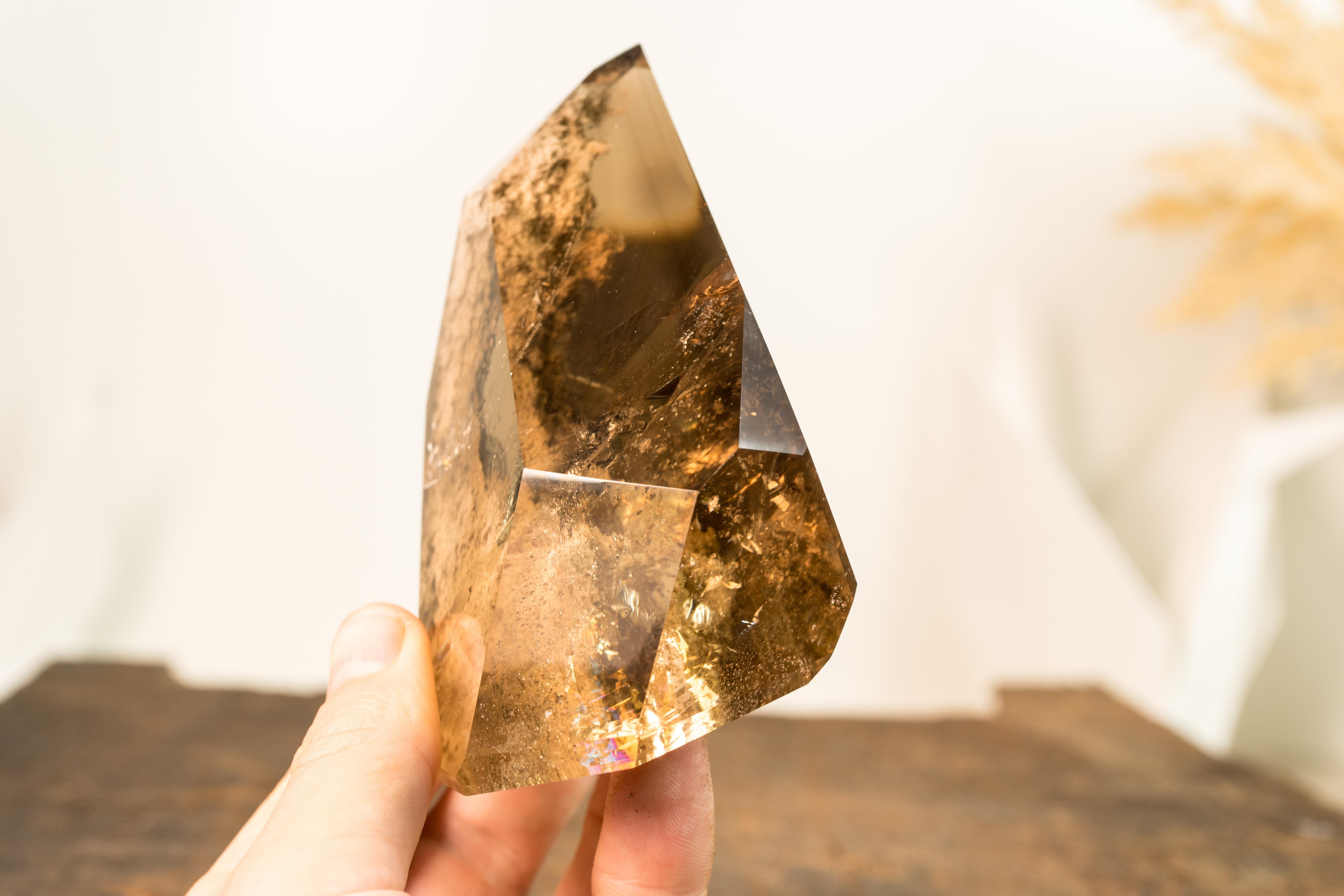 A natural artwork that began forming millions of years ago, this Smoky Citrine Quartz offers a window to the past, encapsulating a landscape within a crystal. This Smoky Citrine Crystal makes a valuable addition to your crystal collection or a