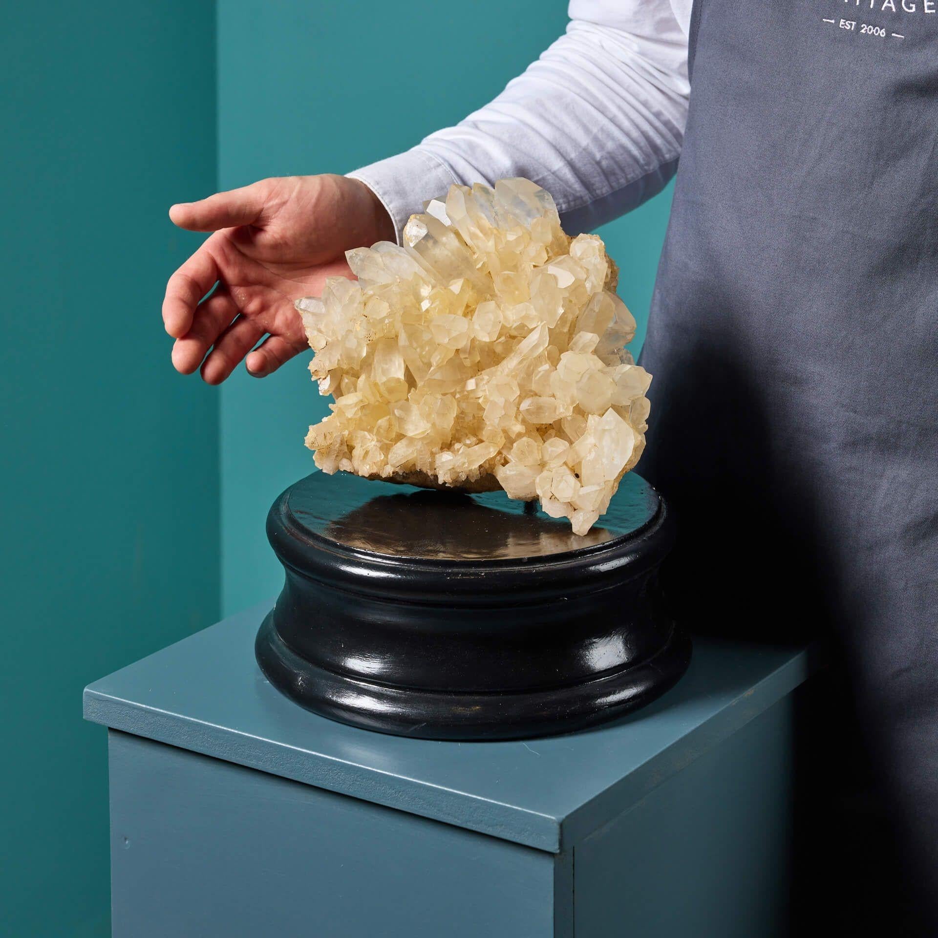 A natural honey quartz crystal specimen originating from Madagascar, presented on one of our museum-quality painted plaster bases.
Formed over millions of years, this natural calcite specimen showcases spectacular scalenohedral crystals - also known