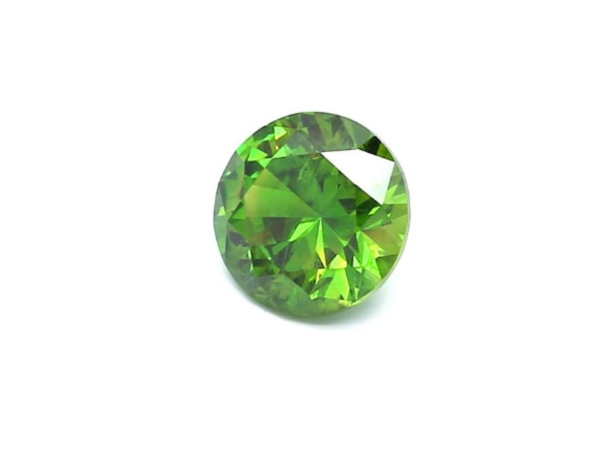 The Demantoid Garnet is a rare gemstone full of brilliance. It's dispersion is higher than diamond, that makes this gemstone very attractive. 
This green garnet was a favorite gemstone of designer Carl Fabergé, who incorporated Demantoid into his